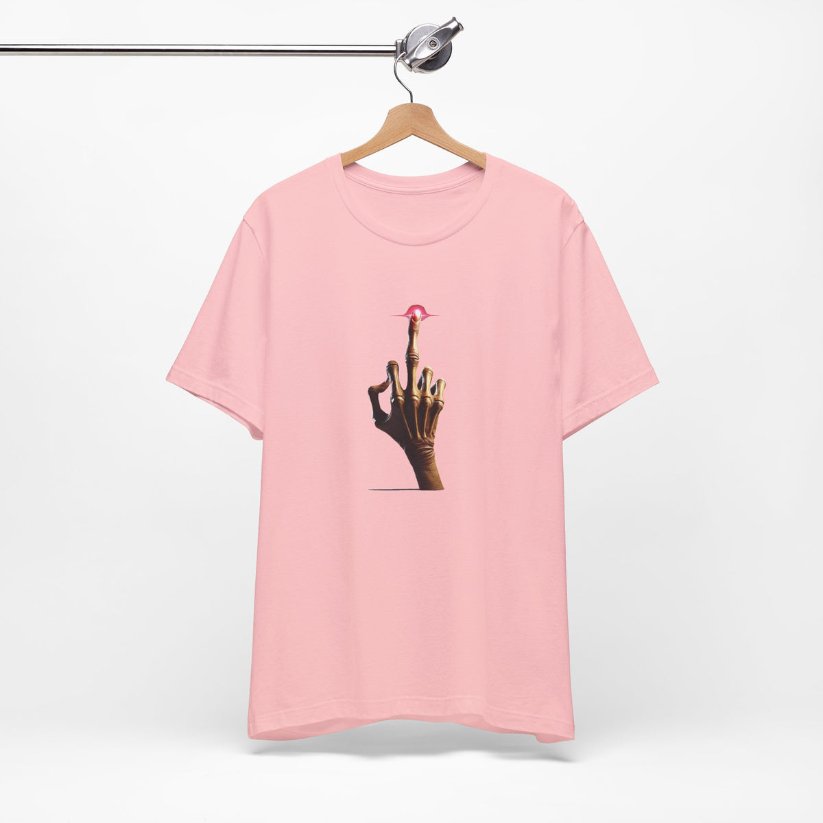 Pink crewneck T-shirt on a wooden hanger with the alien middle finger graphic centered on the front.