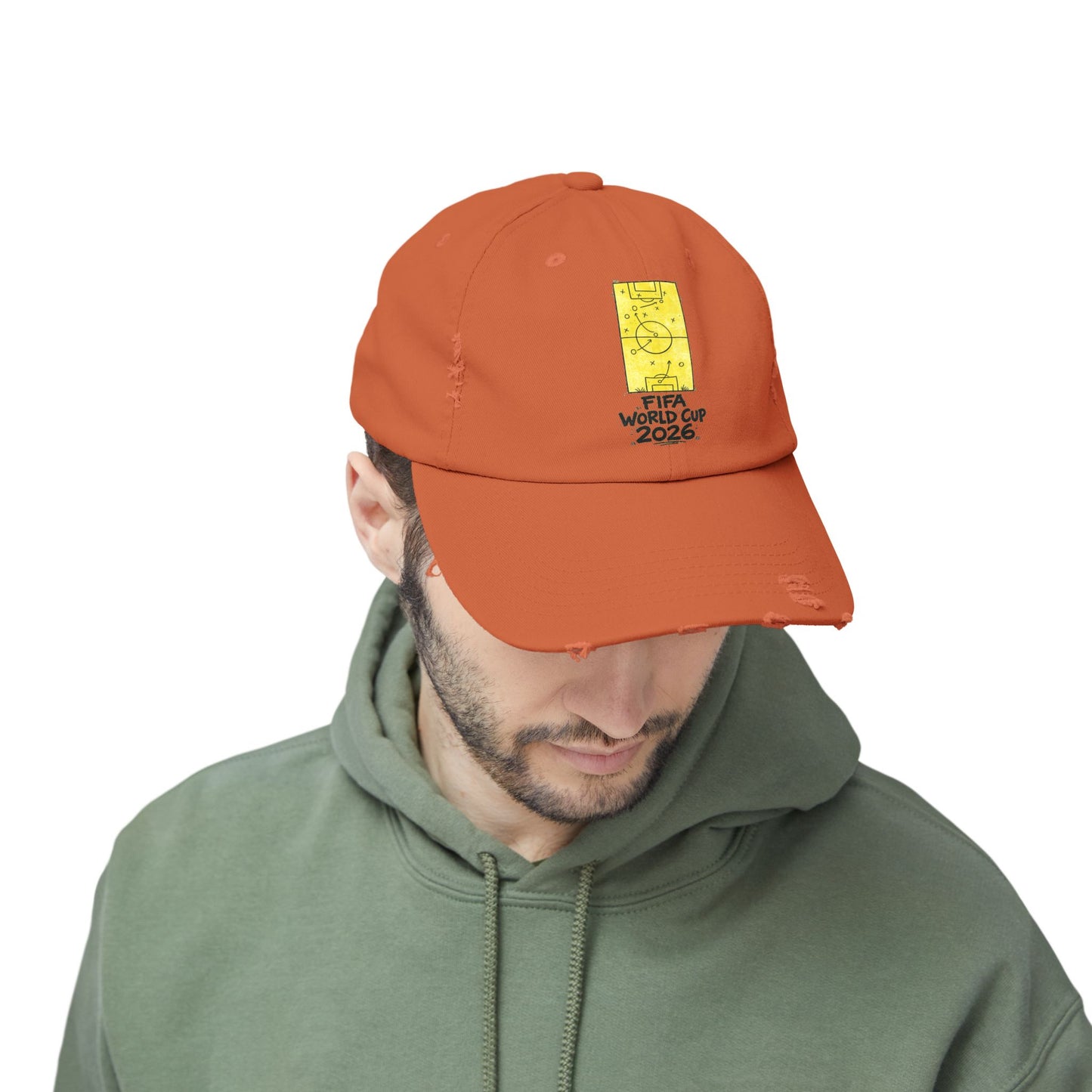 Male model wearing burnt orange FIFA World Cup 2026 distressed dad hat casual streetwear look