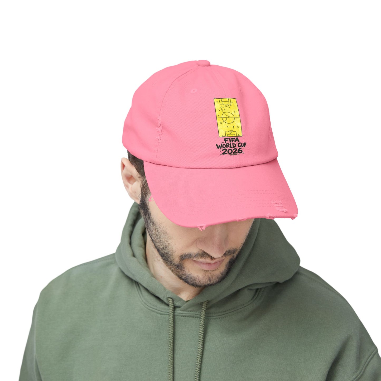 Male model wearing pink FIFA World Cup 2026 distressed dad hat casual streetwear style
