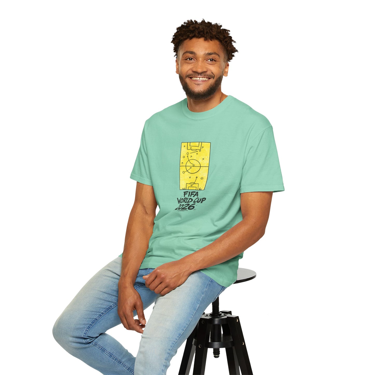 Male model wearing mint green FIFA World Cup 2026 soccer fan t-shirt