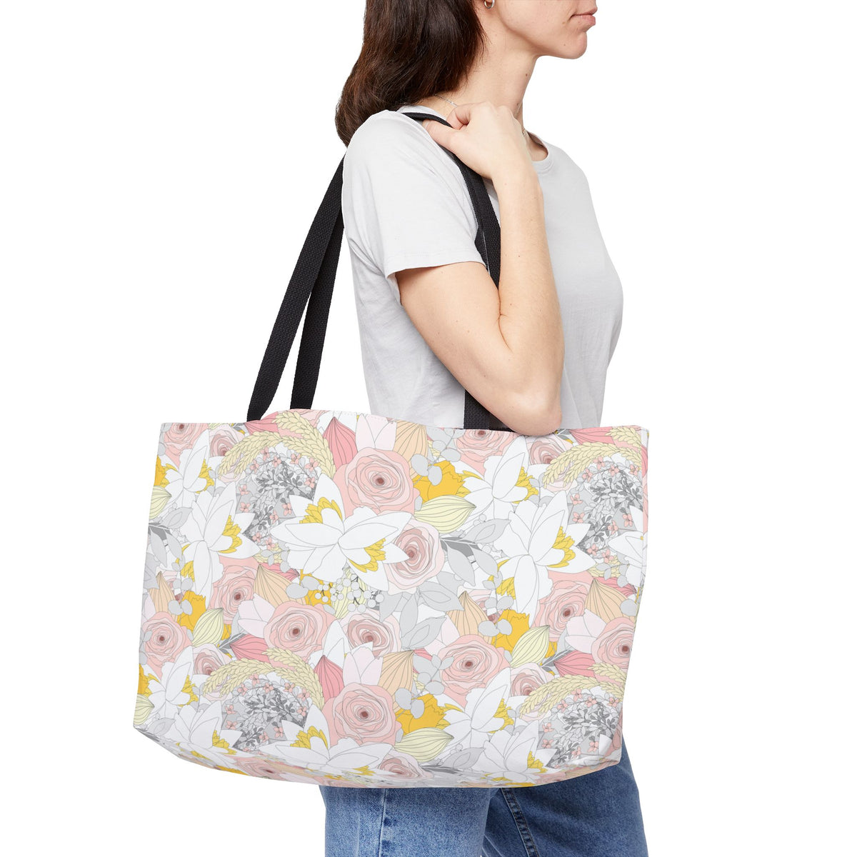 Large floral weekender bag carried by woman