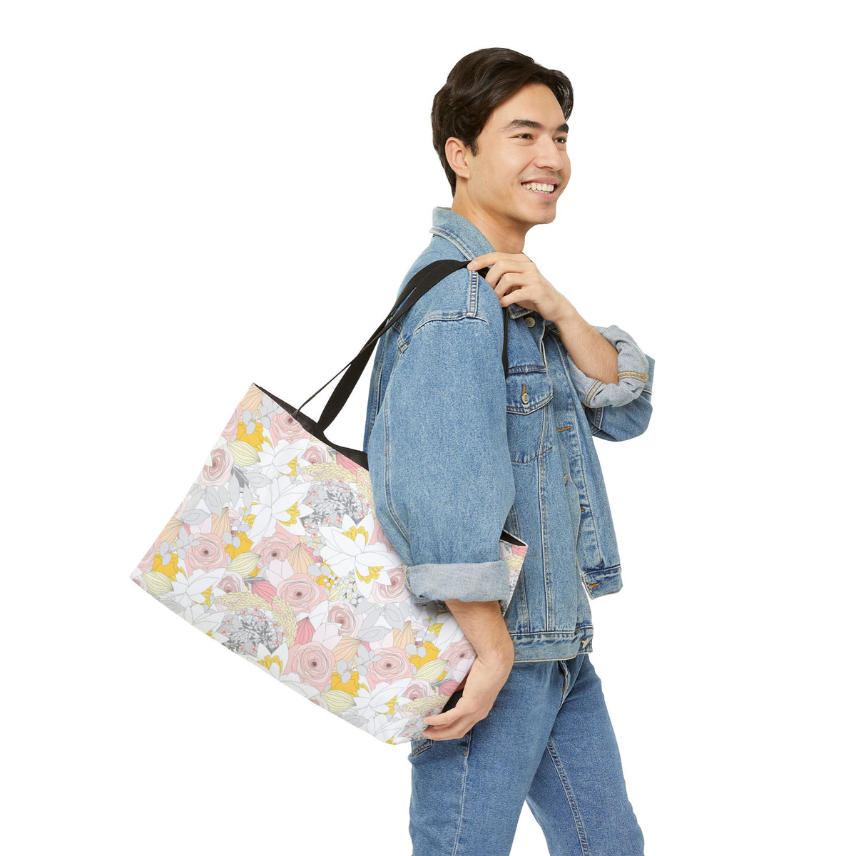 Colorful floral travel tote carried as an oversized weekend bag