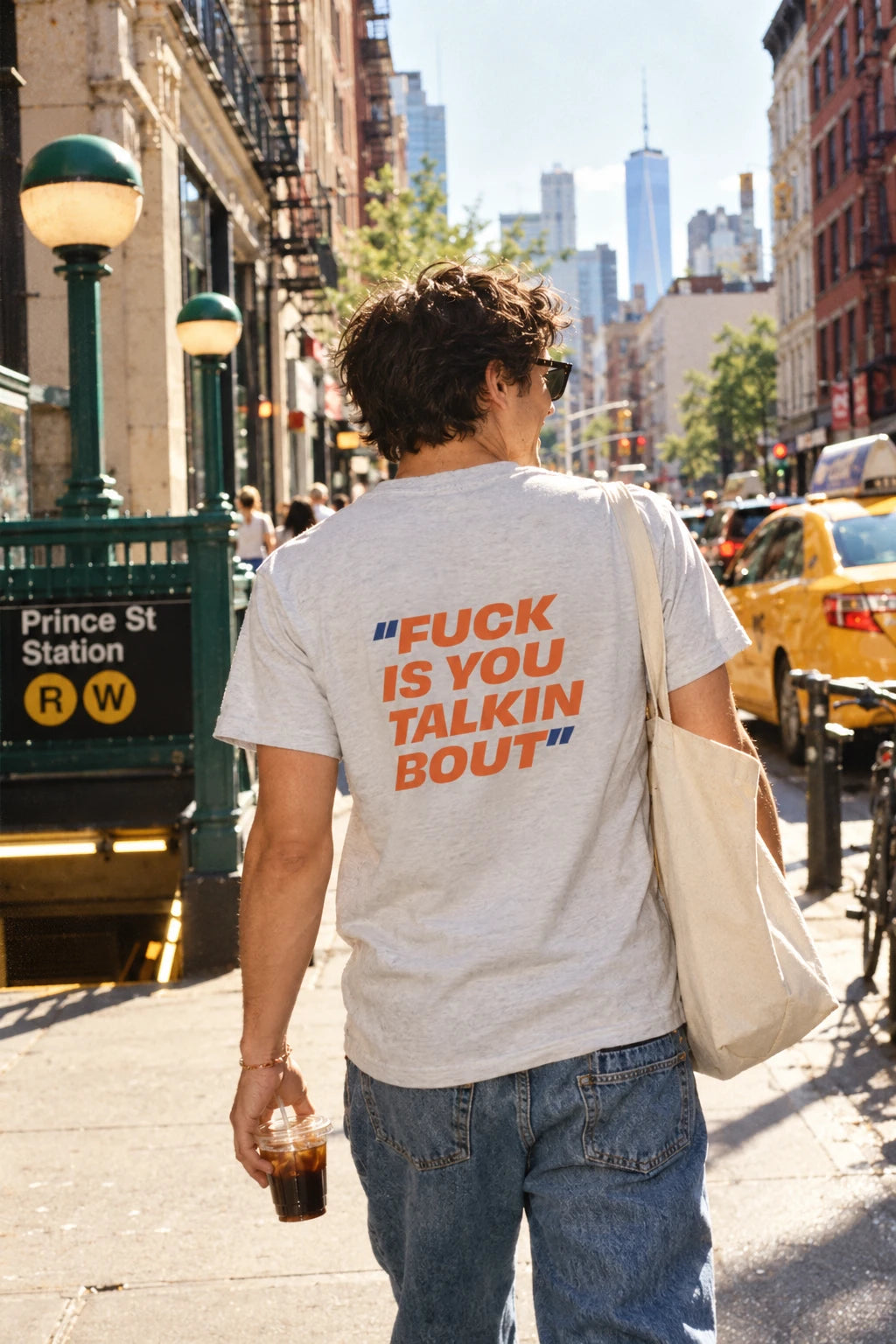 Heather gray Fuck Is You Talkin Bout graphic t-shirt worn near Prince Street in New York City