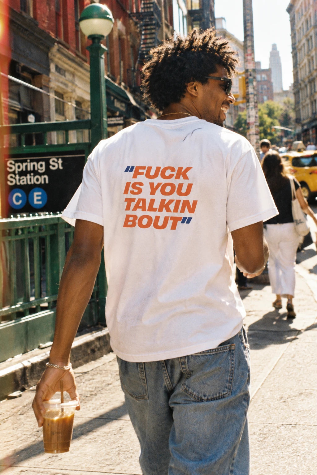 White Fuck Is You Talkin Bout graphic t-shirt worn near Spring Street in New York City