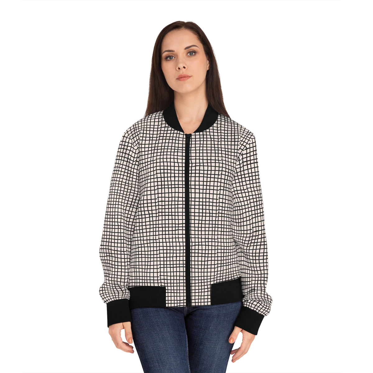 Woman modeling a black and white geometric grid bomber jacket from the front.