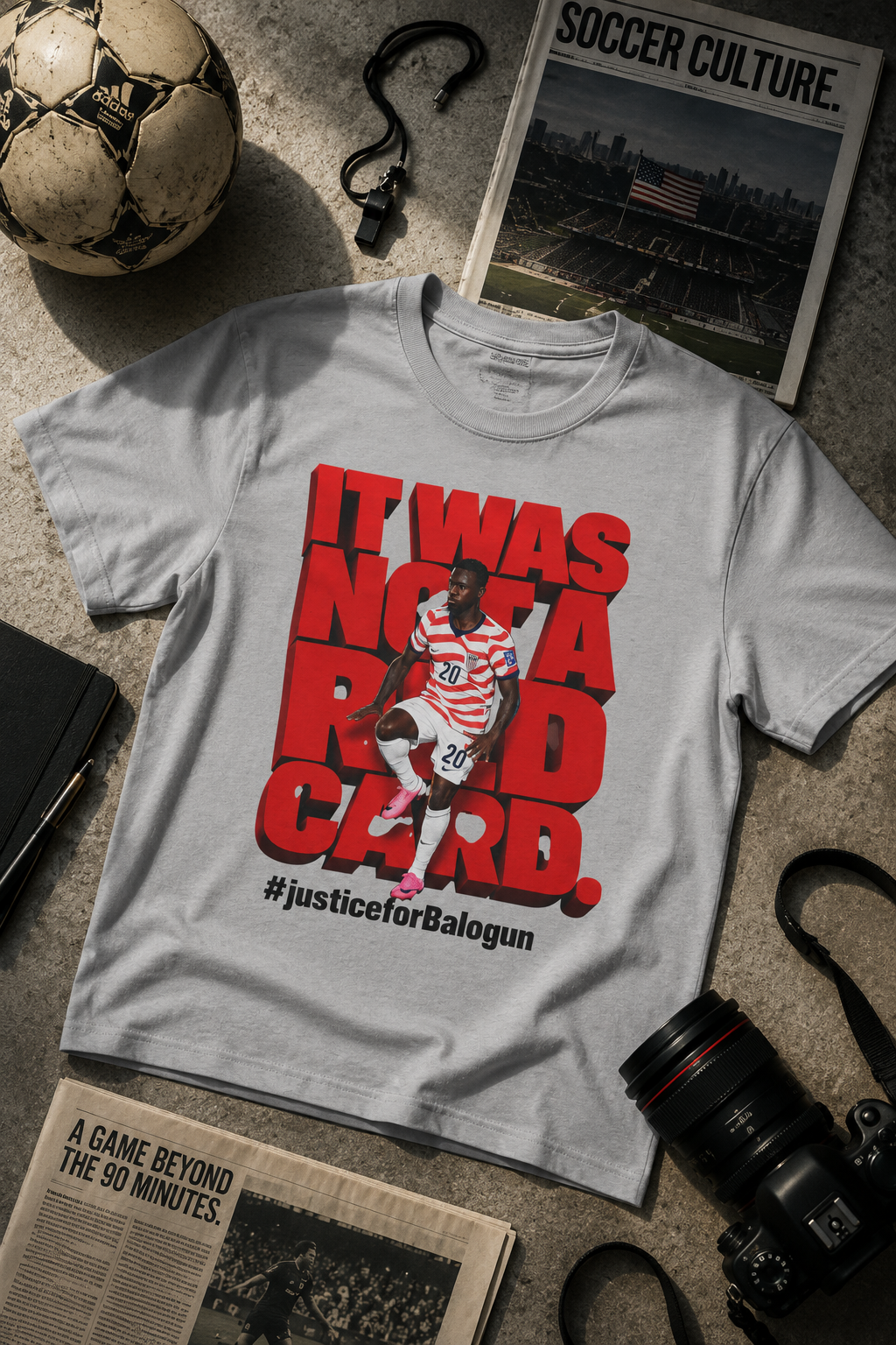 gray It Was Not a Red Card Balogun soccer graphic t-shirt flat lay mockup