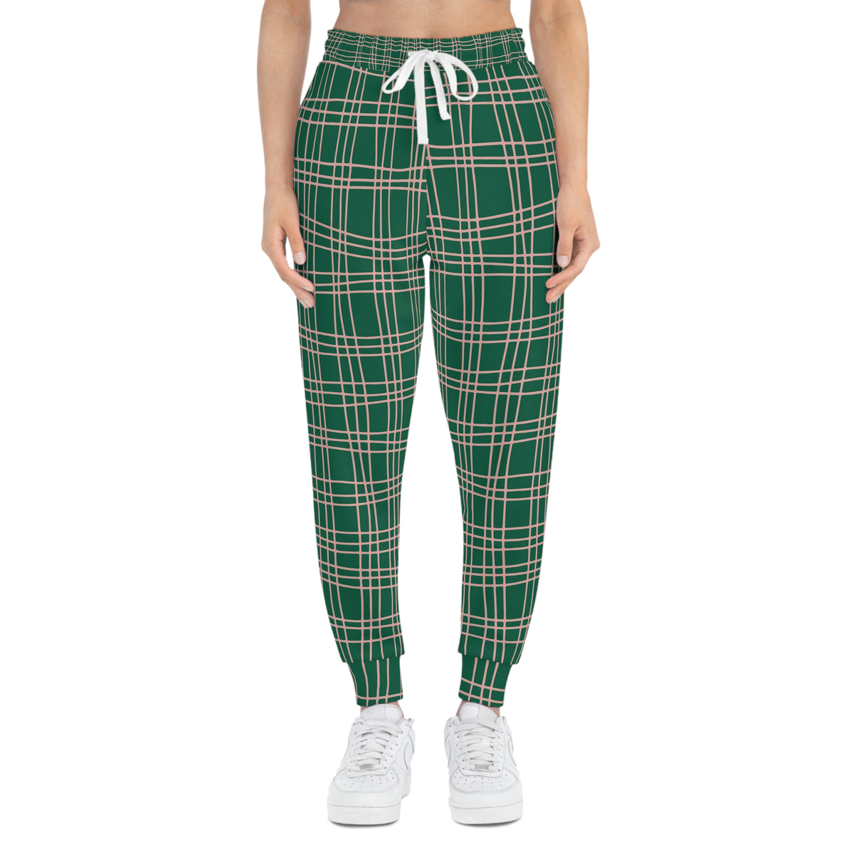 Woman wearing green and pink plaid joggers shown from the front