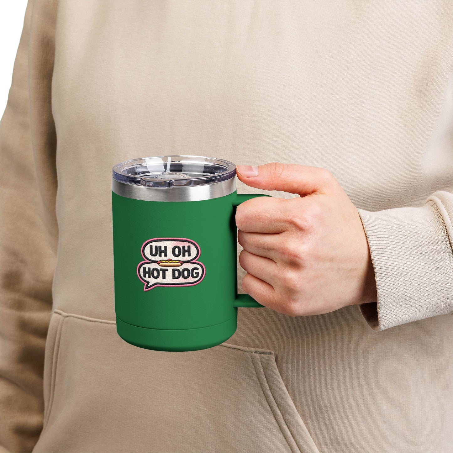 Person holding a green Uh Oh Hot Dog MADtv insulated stainless steel travel mug