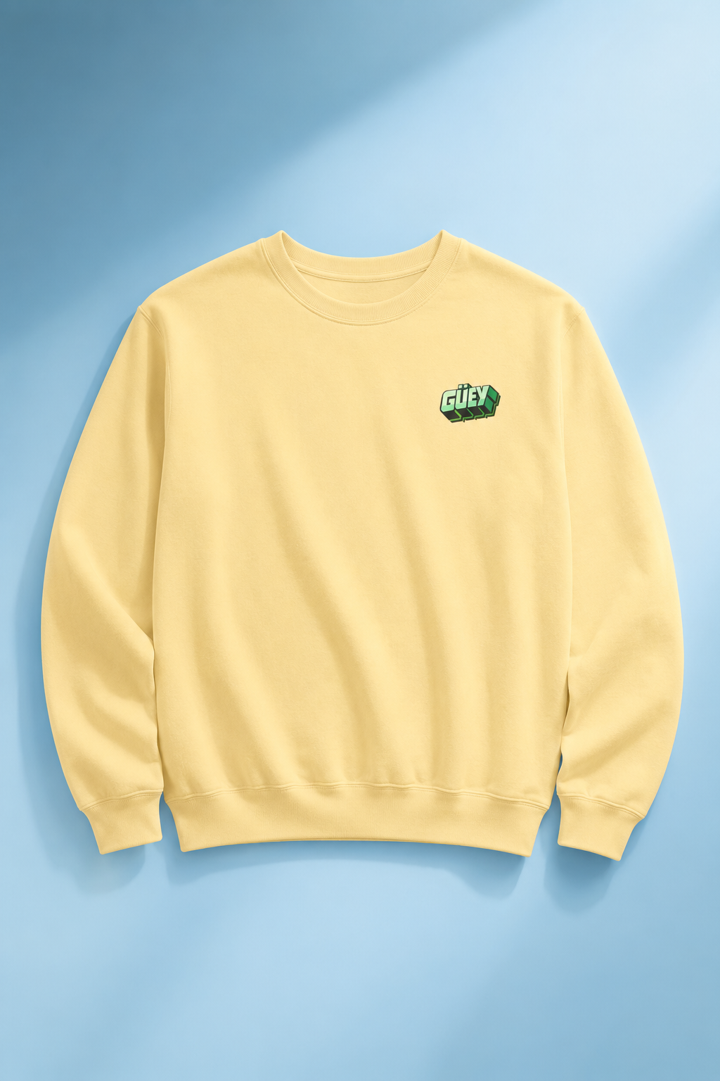 Pastel yellow Güey Mexican slang crewneck sweatshirt front view on a light blue background