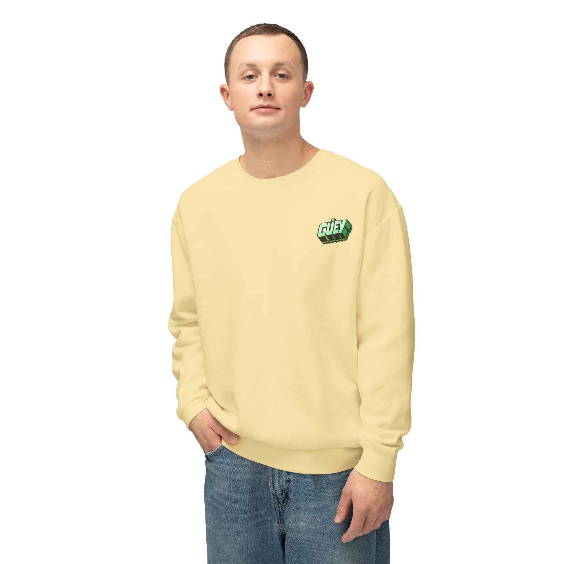 Man wearing a pastel yellow Güey Mexican slang sweatshirt with large graphic, frontal view