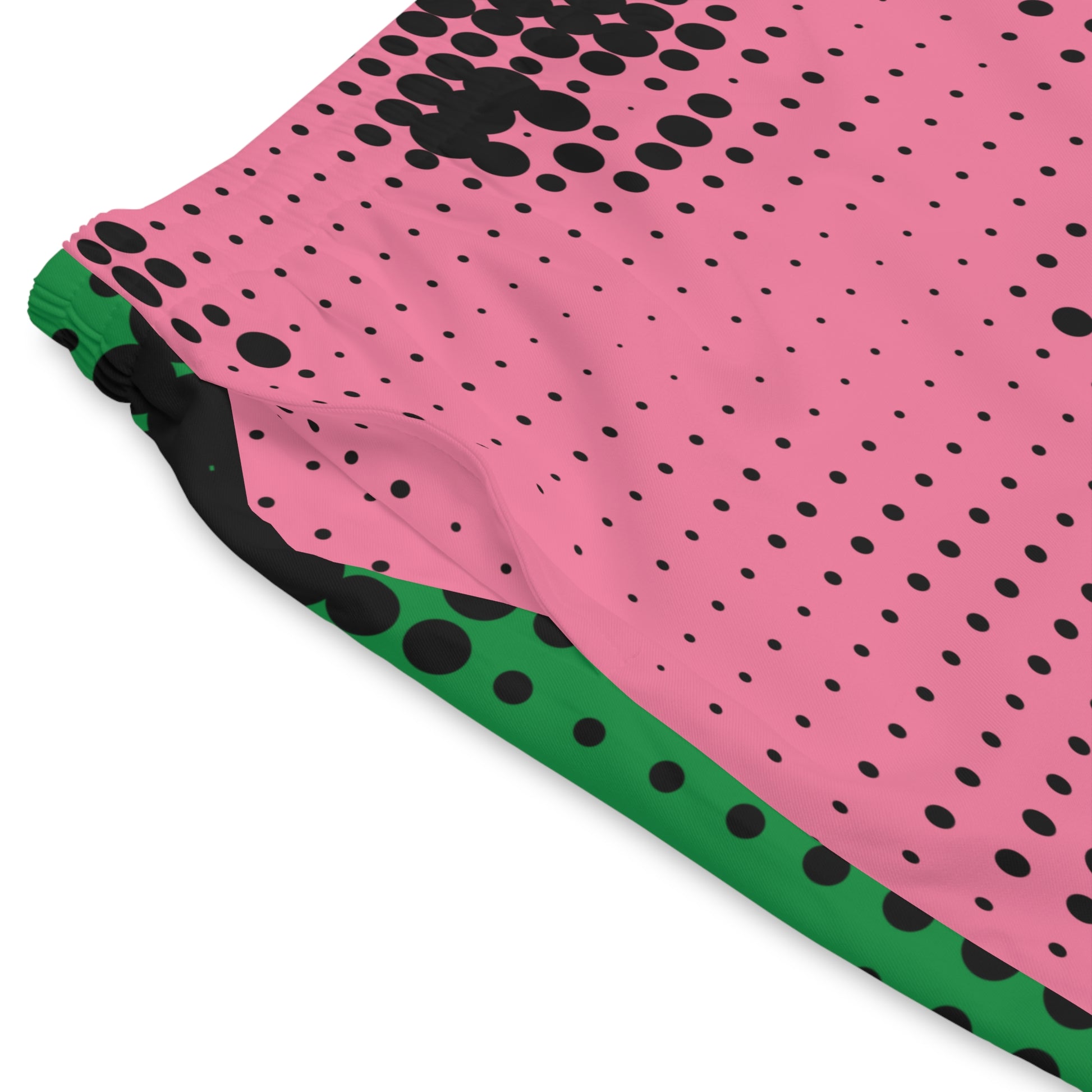 Close-up detail of colorful halftone print swim shorts with artistic retro graphic texture