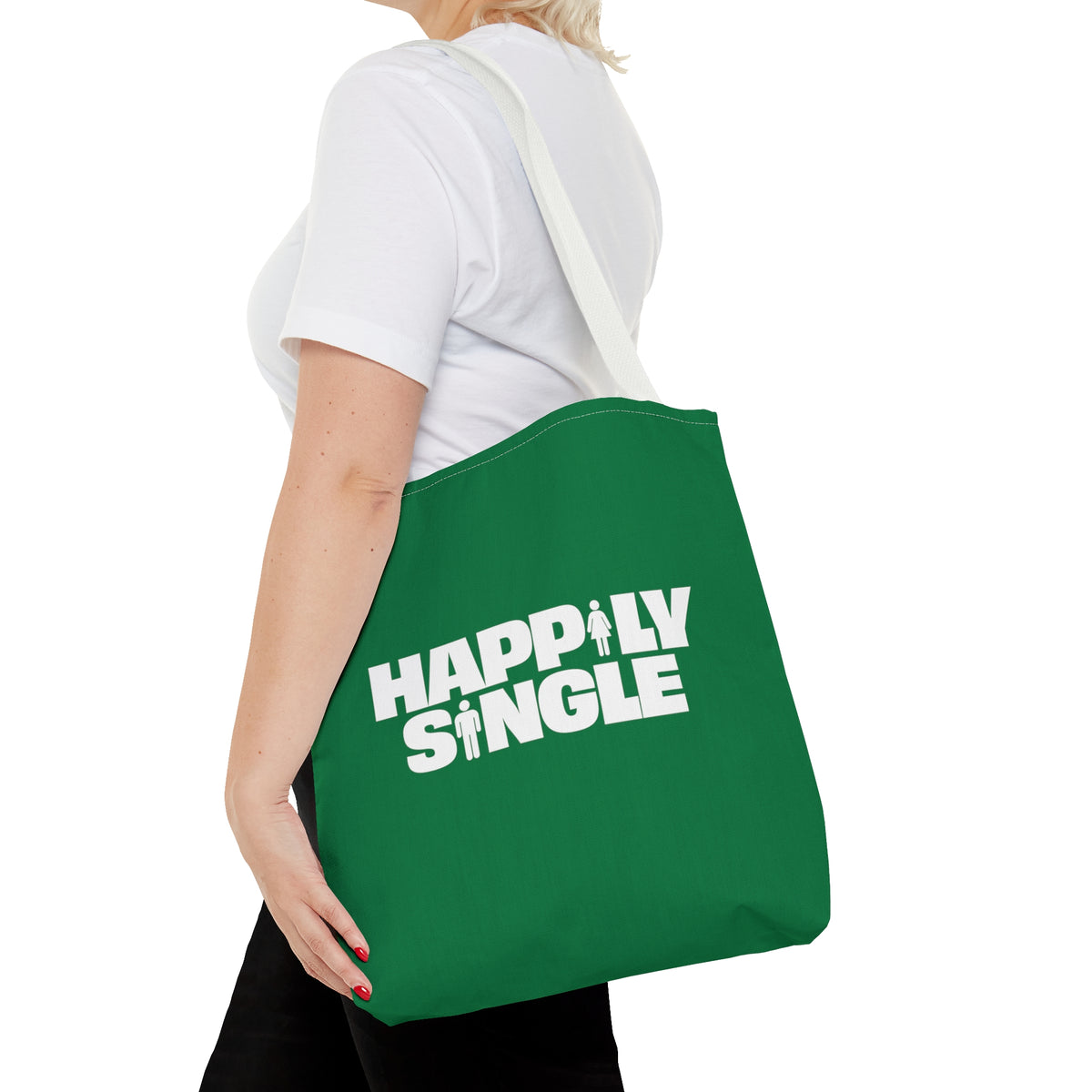 Person holding green Happily Single tote bag from behind