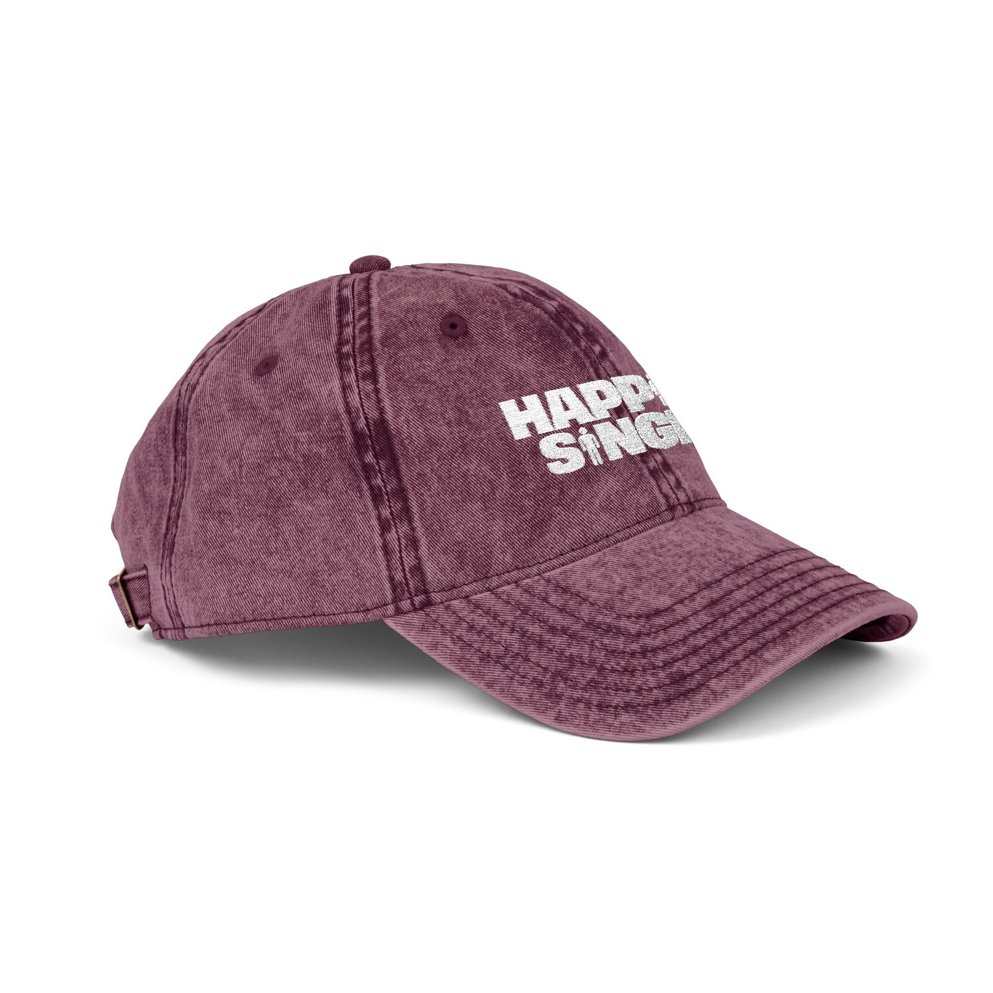 Side profile of a maroon Happily Single baseball cap with embroidered Happily Single design.
