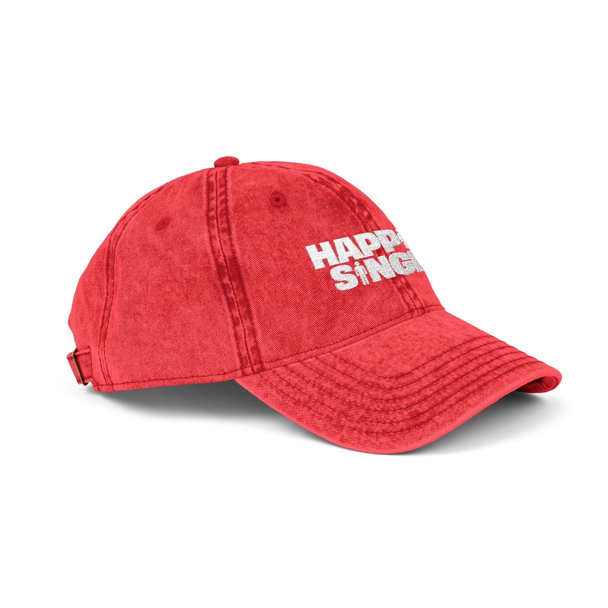 Side profile of a red Happily Single baseball cap highlighting the curved brim and embroidery.