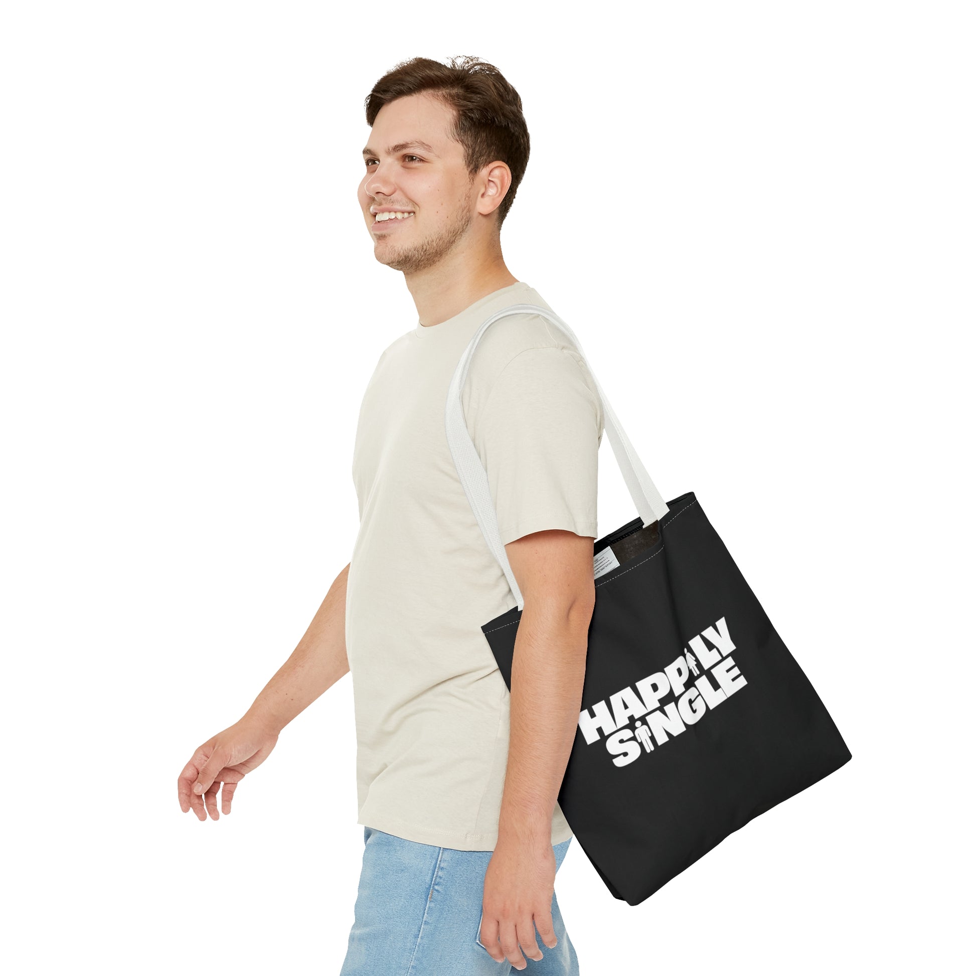 Male model carrying the black Happily Single graphic tote bag over his shoulder.