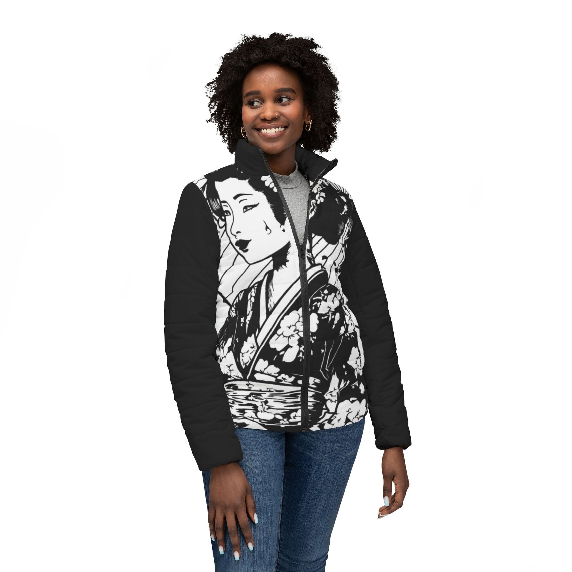 Woman wearing a black and white Japanese art jacket from the back on an autumn city street.