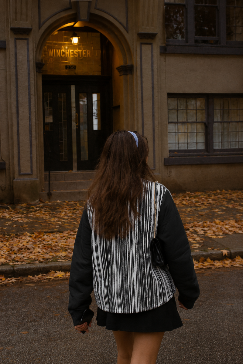 Back product view of black and white Japanese graphic jacket with vertical brushstroke stripes and black sleeves.