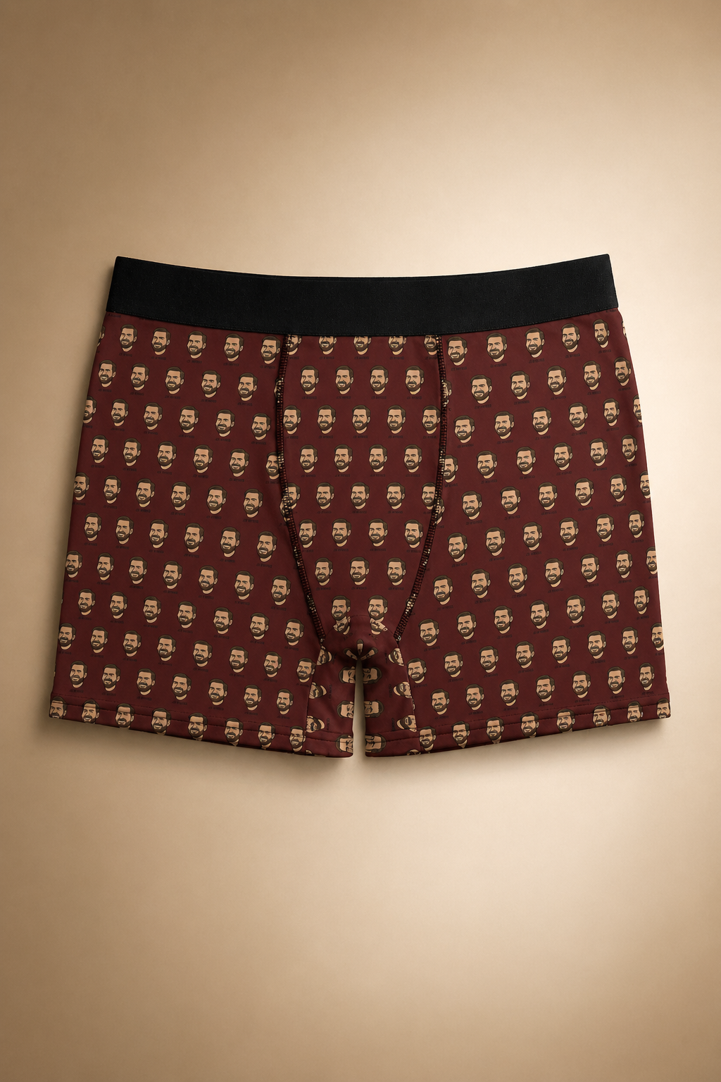 Brown boxer briefs with repeating cartoon face pattern, minimalist editorial product image, graphic political underwear