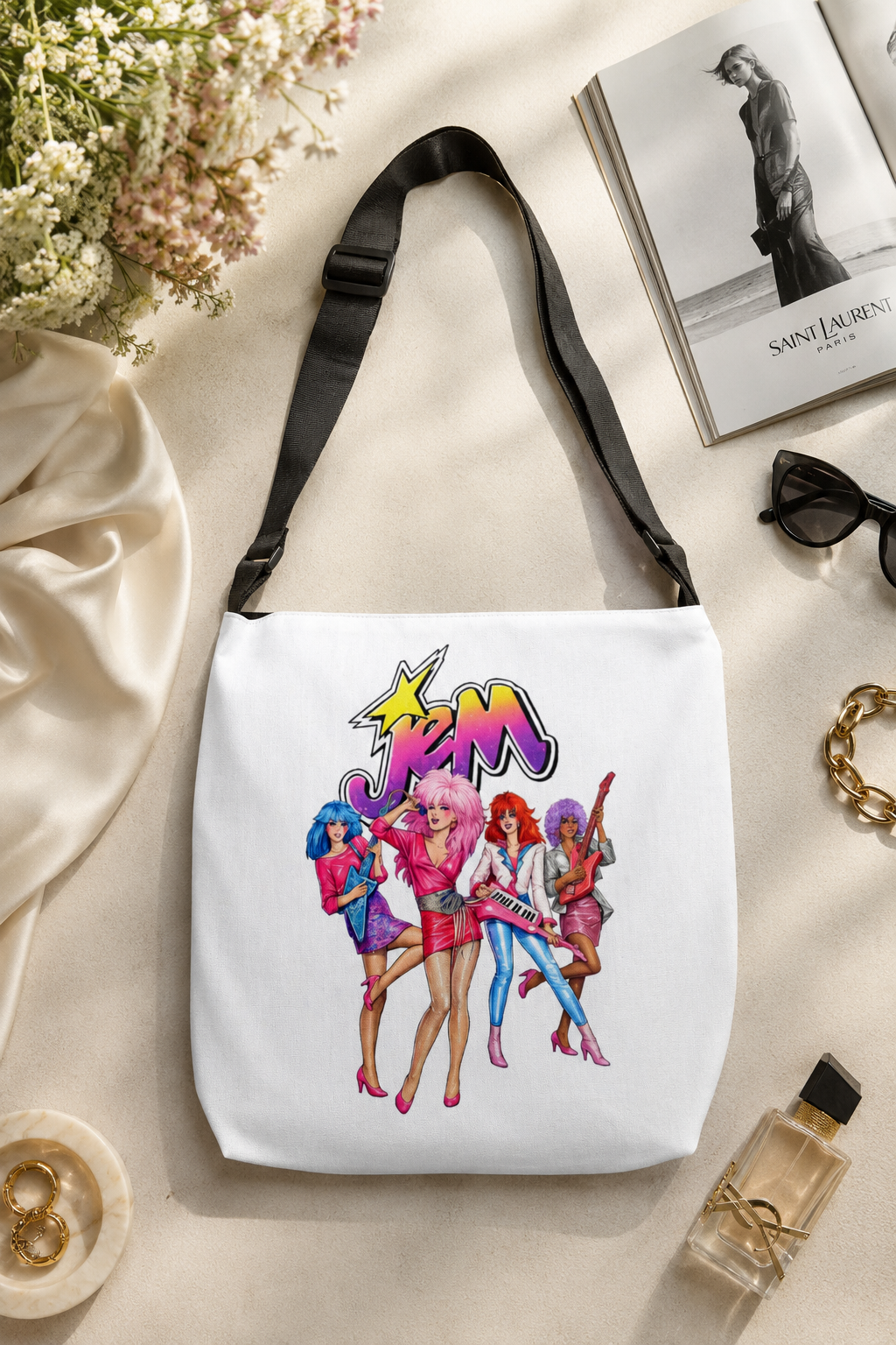 Jem and the Holograms retro cartoon tote bag arranged in an elegant editorial flat lay