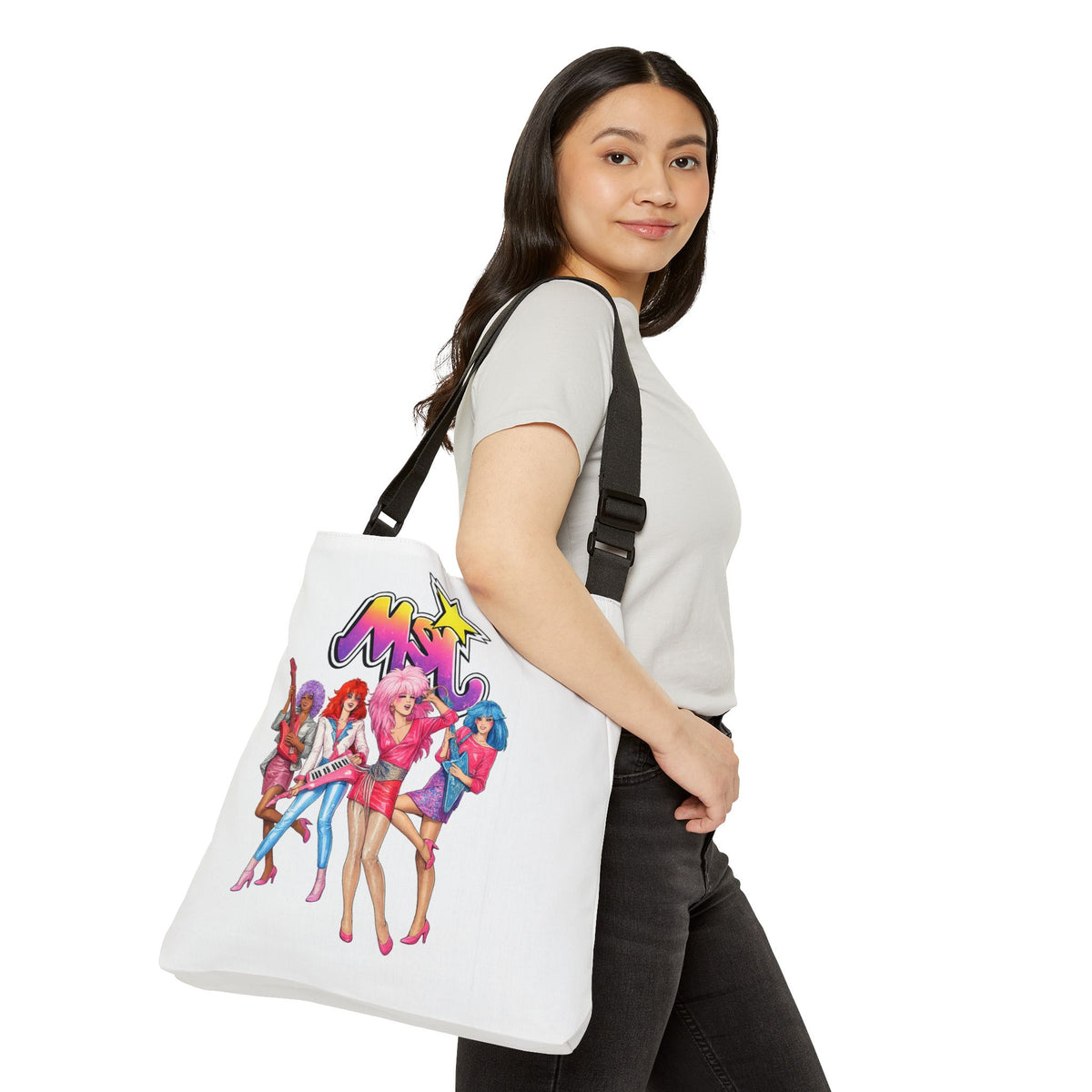 Side view of a female model carrying the Jem and the Holograms tote bag