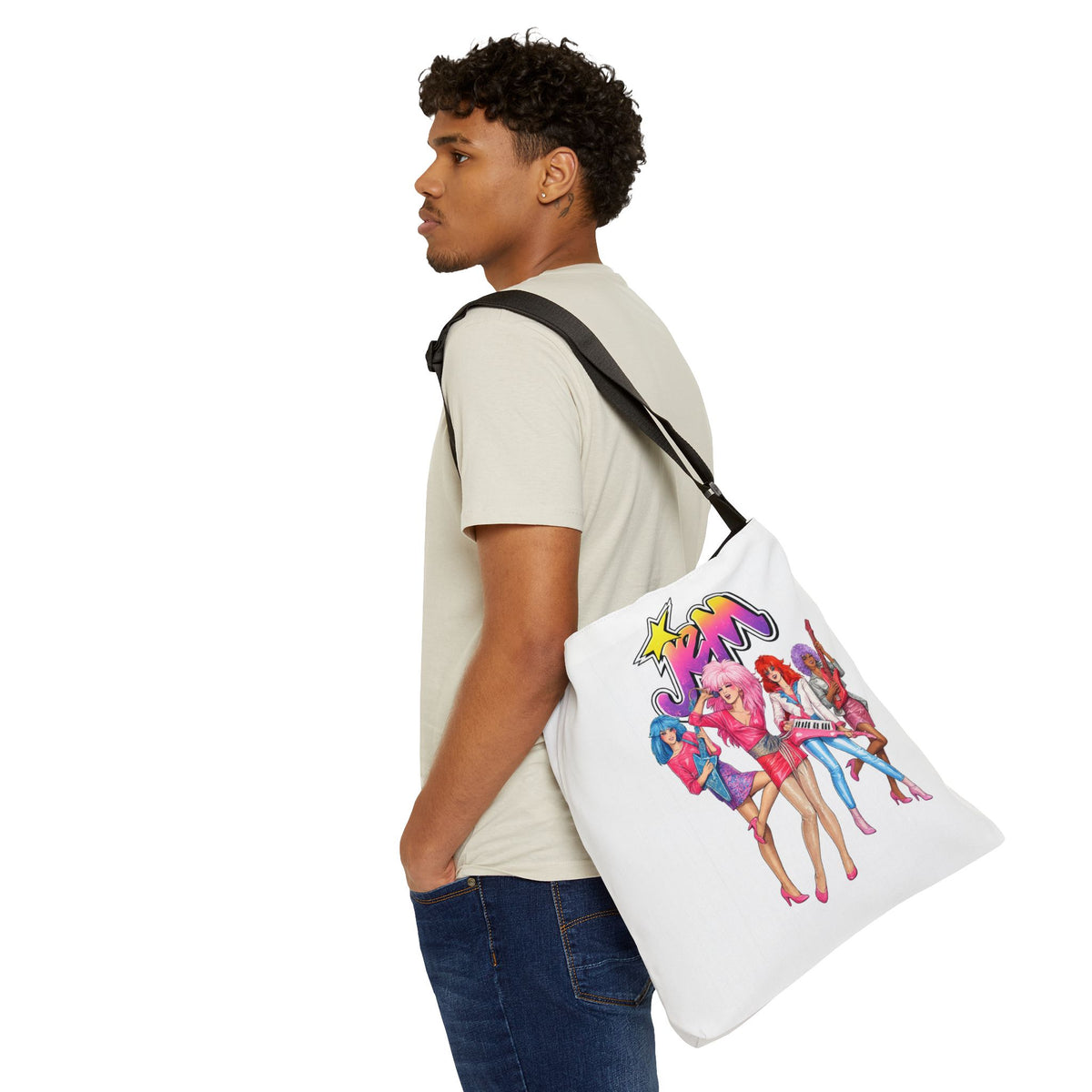 Male model carrying a white Jem and the Holograms tote bag over his shoulder