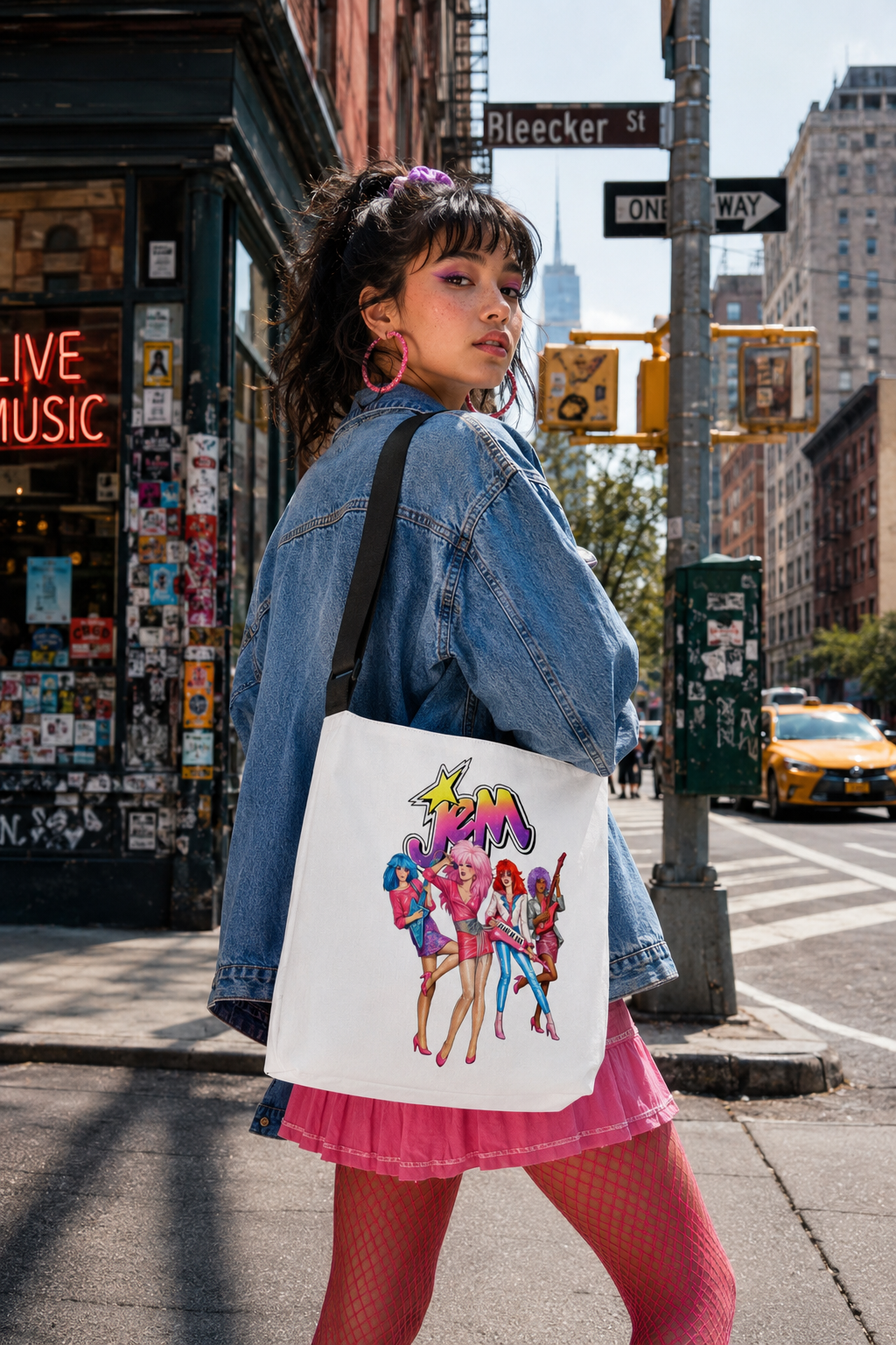 Gen Z woman carrying a Jem and the Holograms tote bag on a New York City street