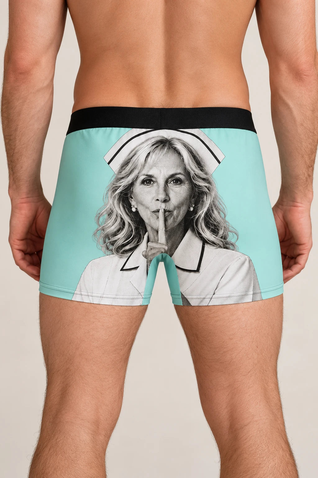 Studio rear view of man wearing Jill Biden Keep Quiet boxer briefs with large portrait graphic