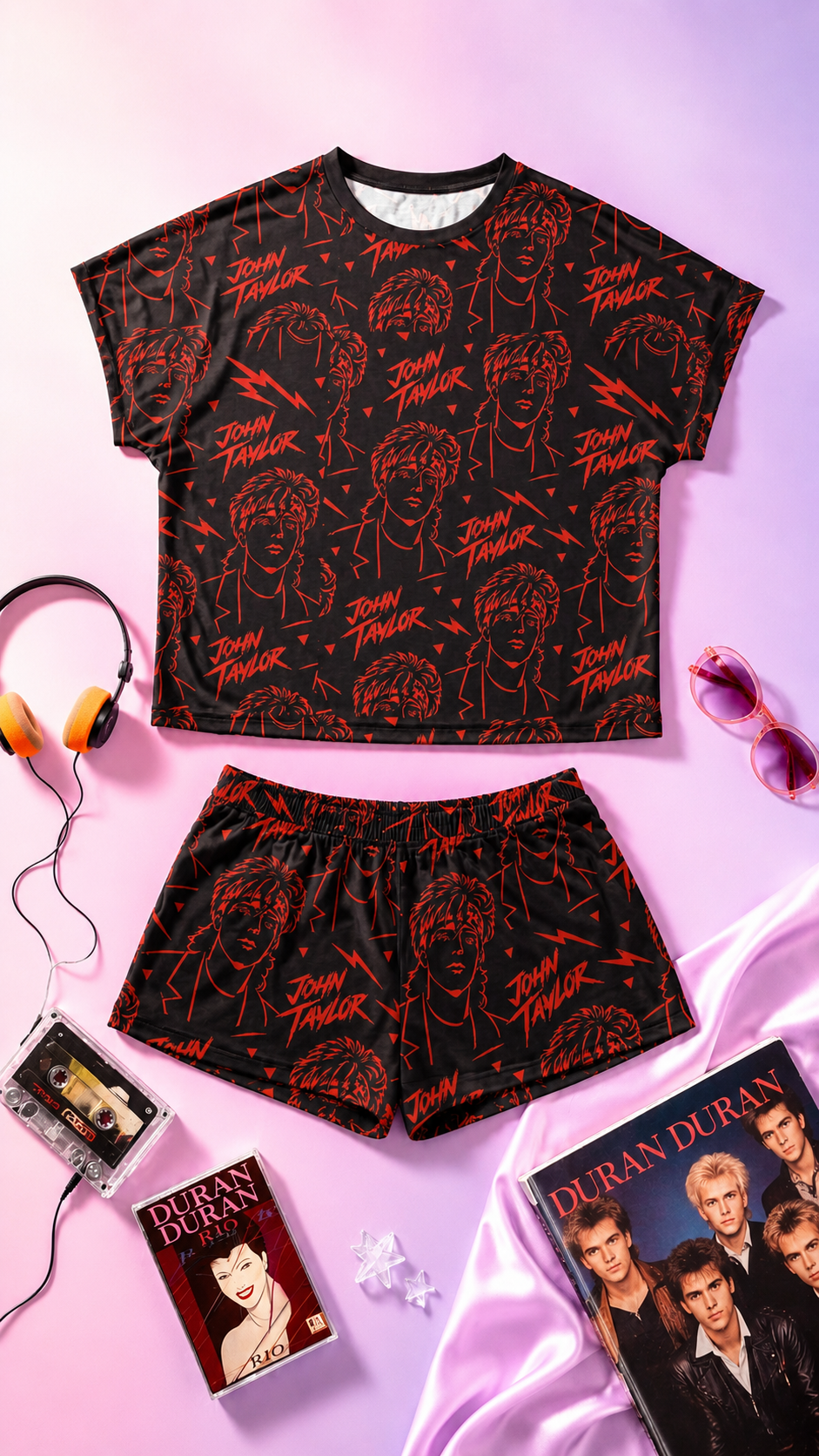 Editorial flat lay mockup of John Taylor women’s pajama set with retro 80s music inspired all-over print on soft pink and purple gradient background with Duran Duran aesthetic accessories