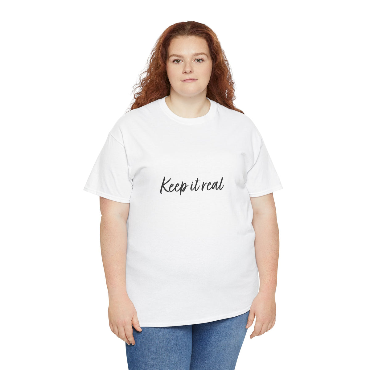 Woman modeling Tantrum Media’s white Keep It Real T-Shirt with a crew neck, black script lettering and blue jeans.