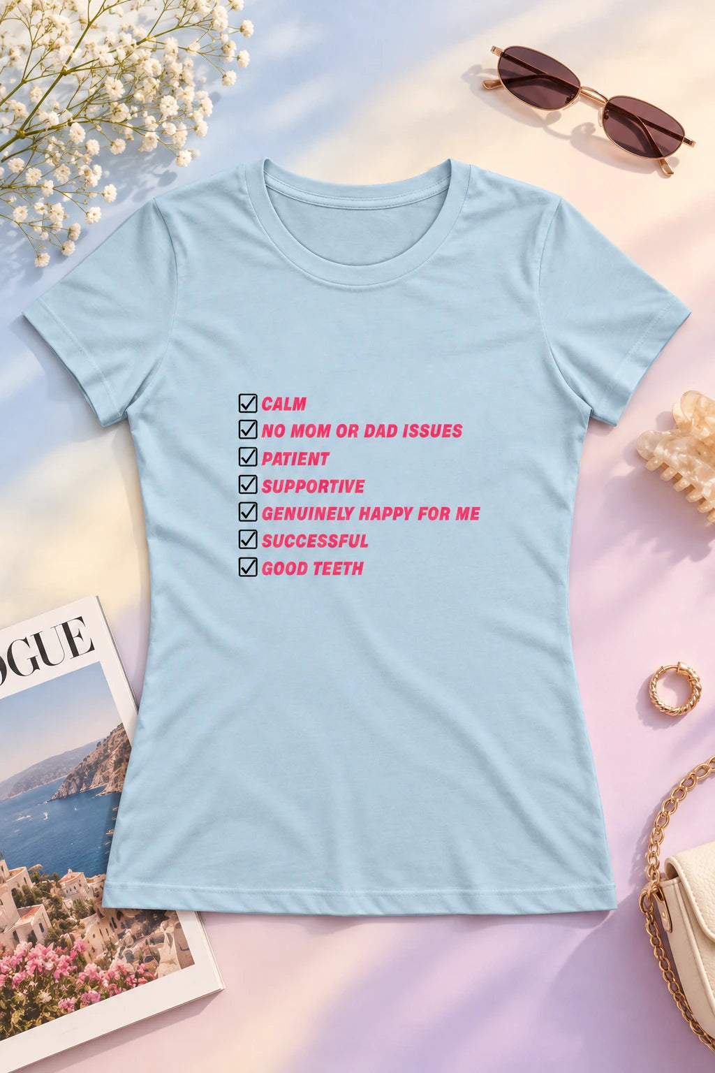 Light blue Kim Kardashian Boyfriend Must Have List women’s T-shirt styled flat lay with pink checklist print