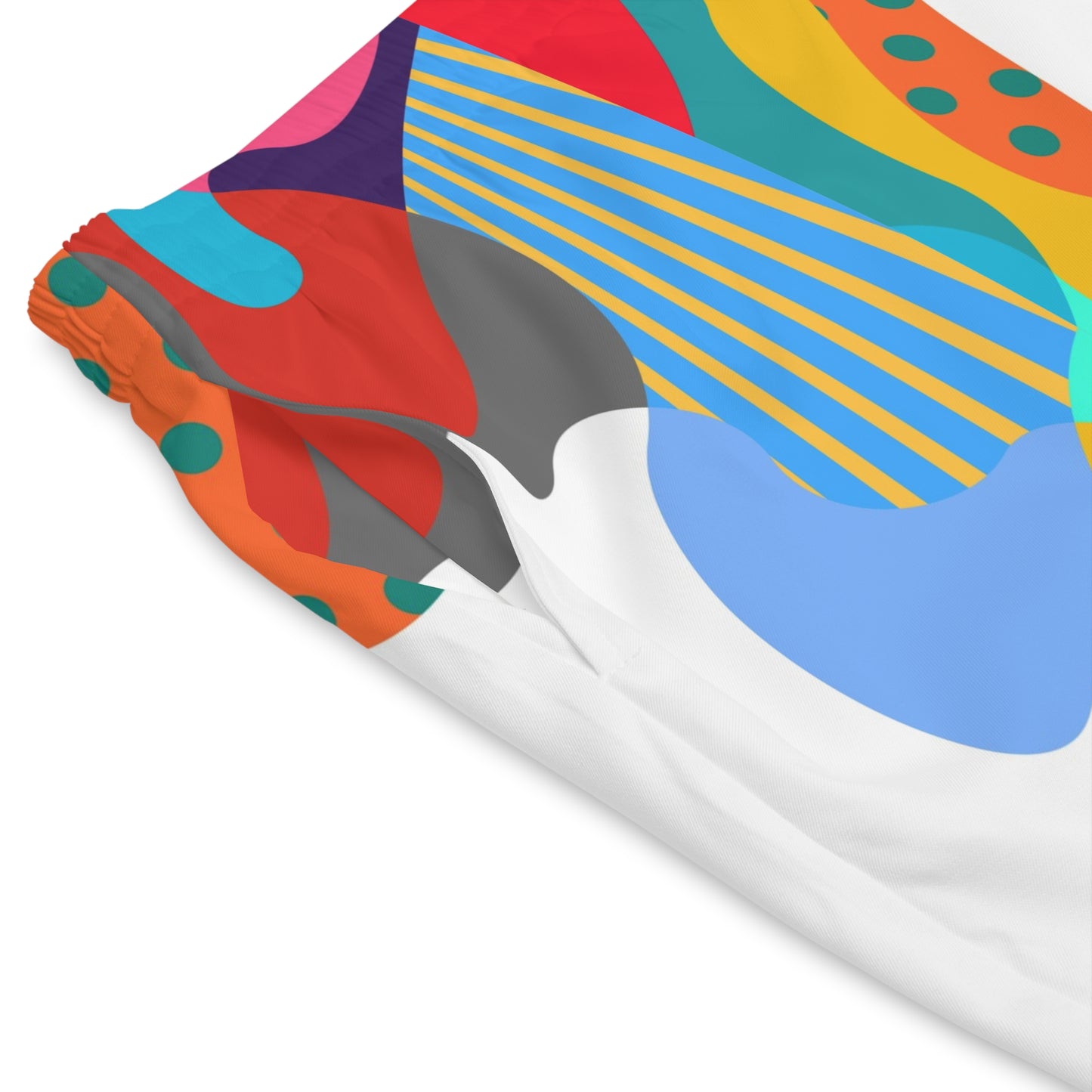 Close-up fabric detail of Kinder Toy Retro Men’s Beach Shorts showing colorful abstract summer print