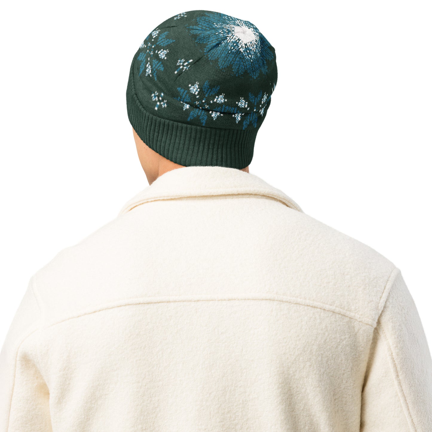 Studio view of a person wearing the dark green winter patterned beanie facing away.