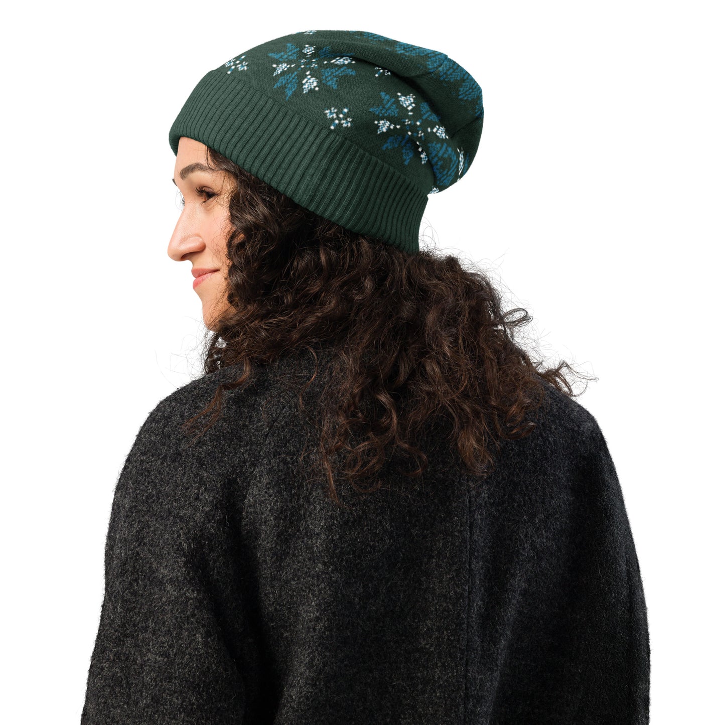 Side view of a person wearing the dark green patterned beanie and a dark sweater.