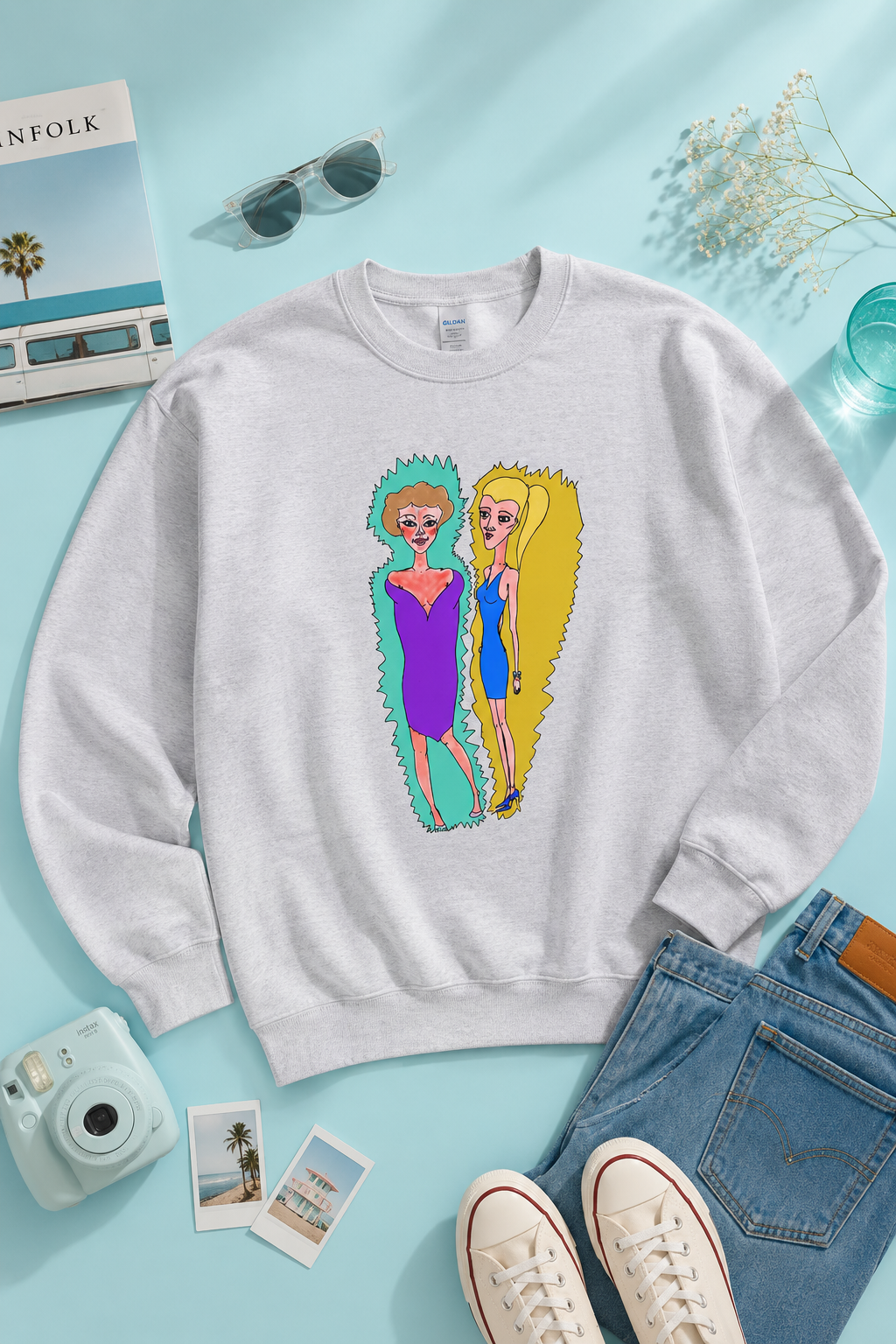 Gray Lads Unisex Graphic Sweatshirt flat lay on a soft cyan background featuring original illustrated artwork.