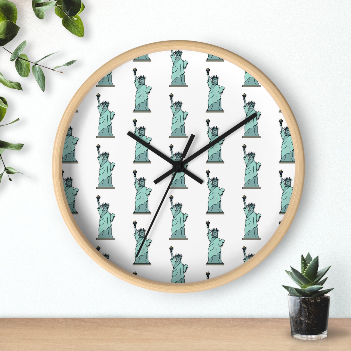 Lady Liberty wall clock with natural wood frame styled with greenery and modern decor