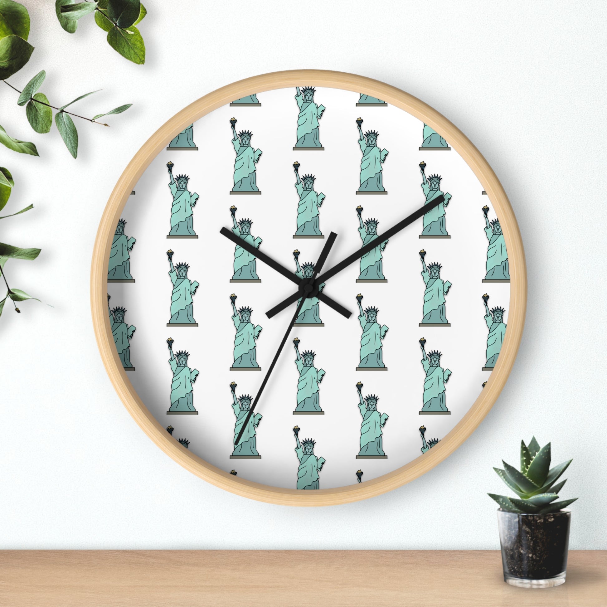 Lady Liberty wall clock with natural wood frame styled with greenery and modern decor