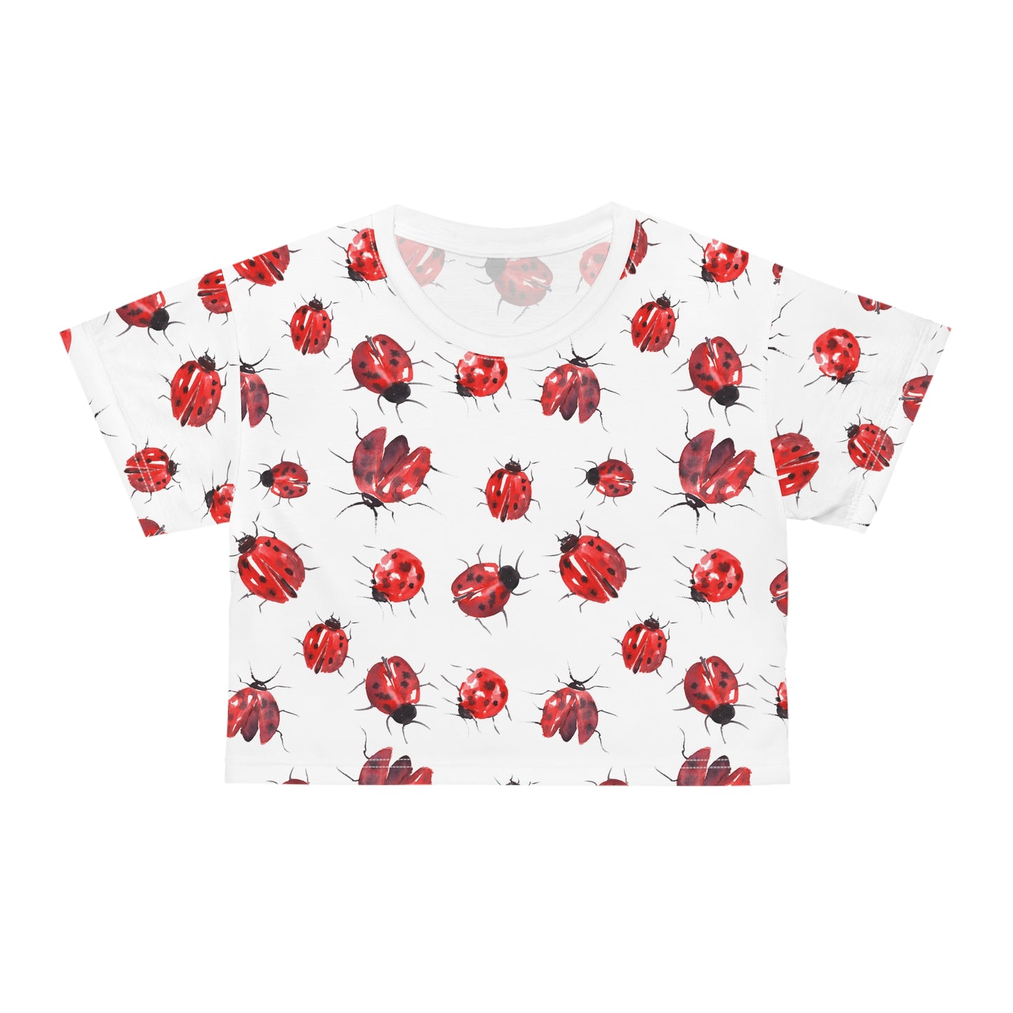 Front view of white ladybug print crop top with playful red insect graphics