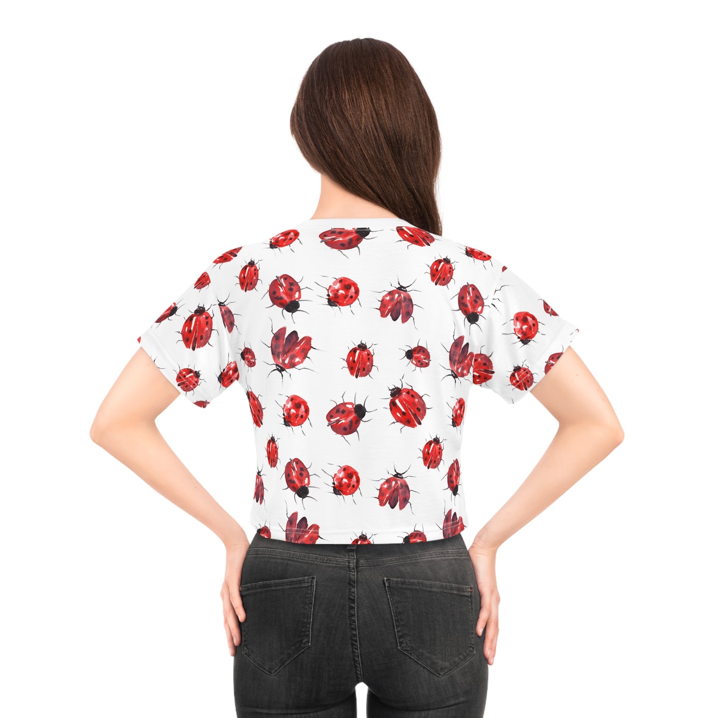 Back view of female model wearing ladybug print crop top with all-over ladybug graphic pattern