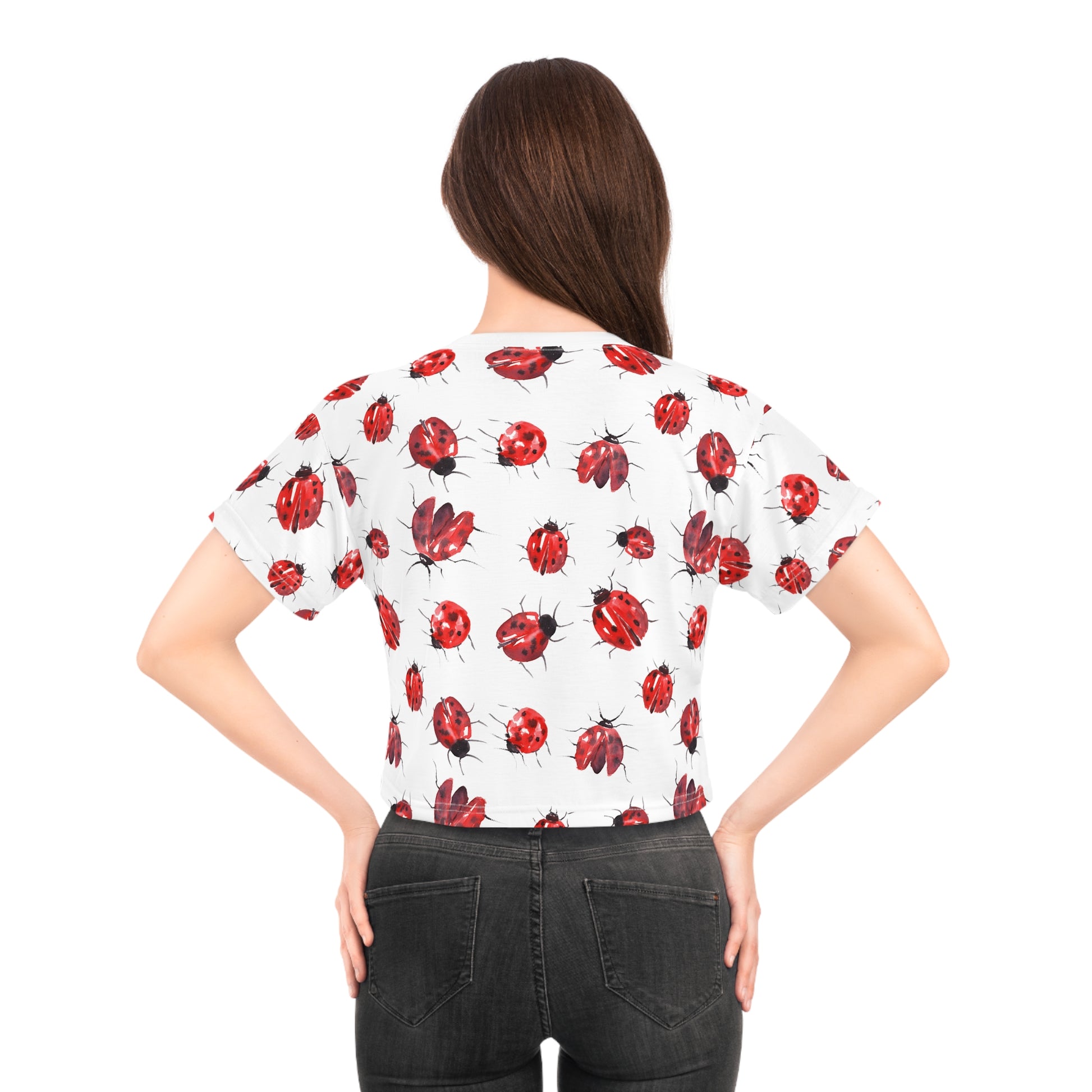 Back view of female model wearing ladybug print crop top with all-over ladybug graphic pattern