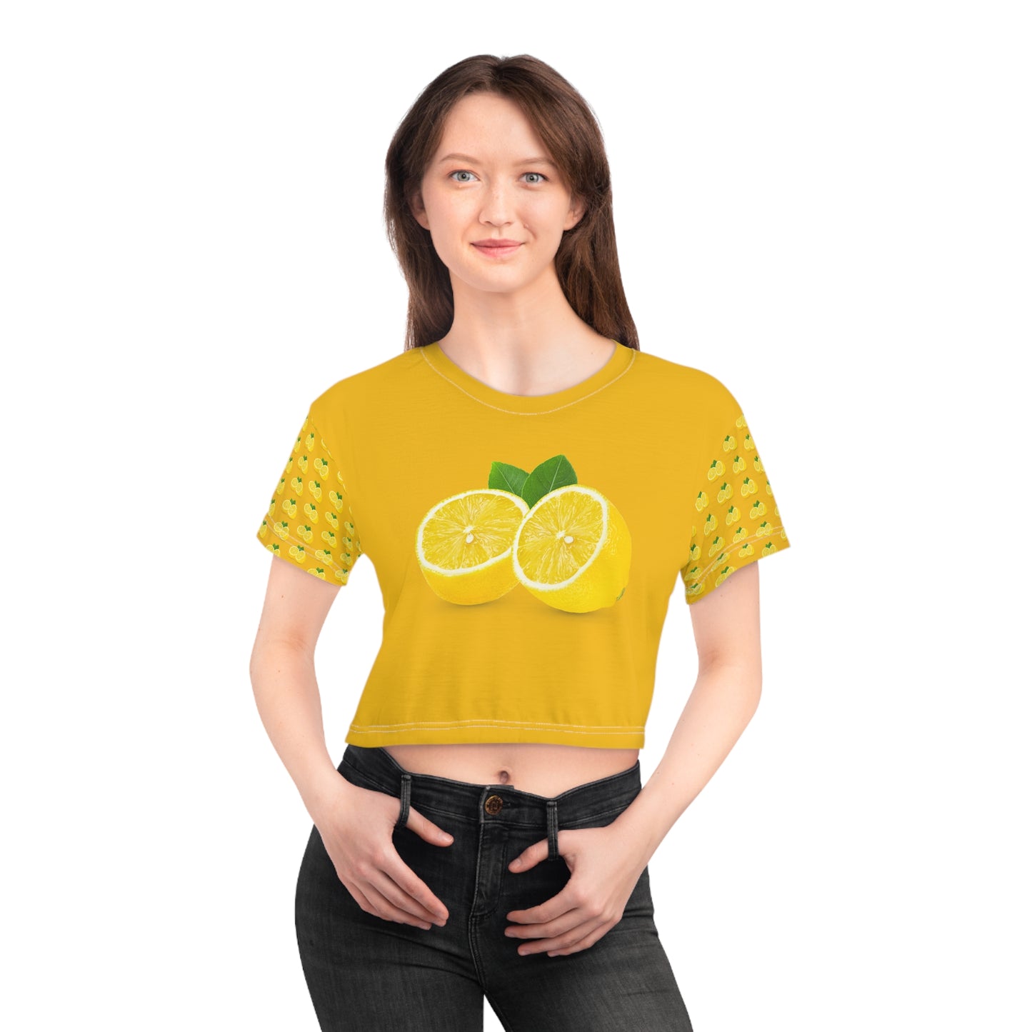 Front view of female model wearing yellow lemon slice crop top with citrus artwork