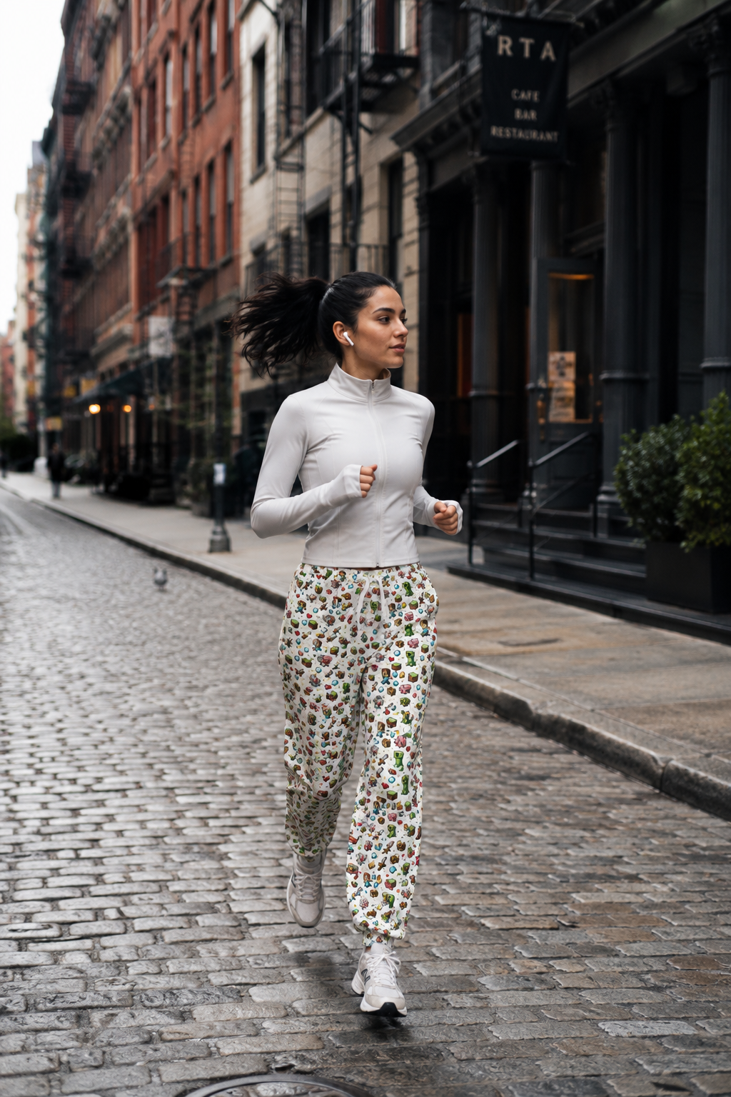 Model walking outdoors wearing Level Up Gamer Joggers styled as gaming streetwear.