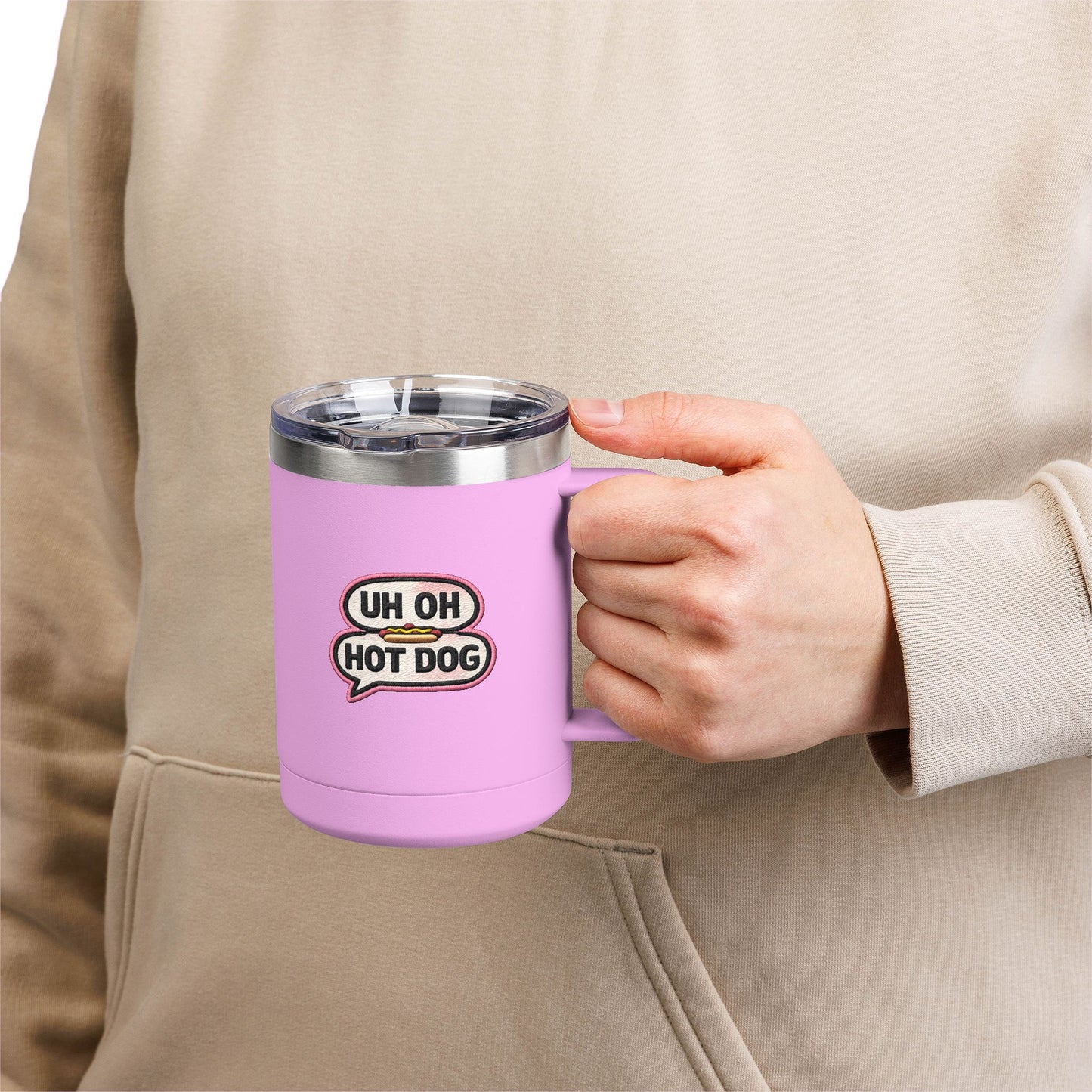 Person holding a light purple Uh Oh Hot Dog MADtv insulated travel mug