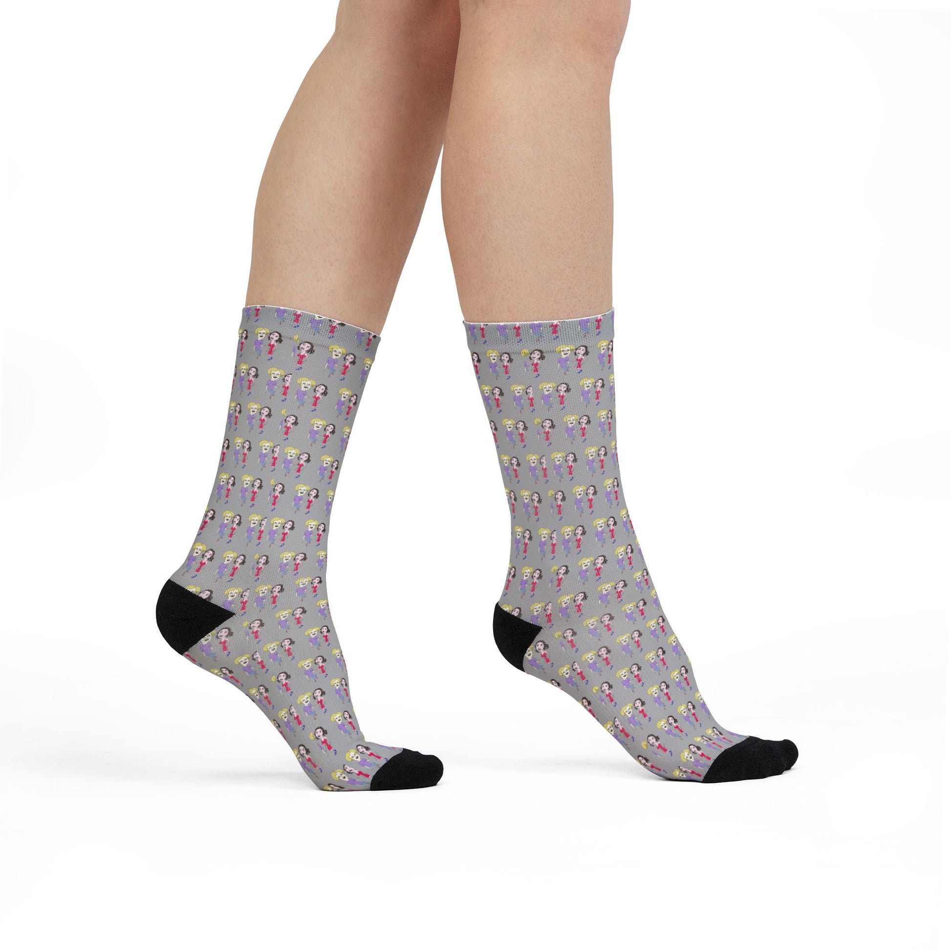 Model wearing Lily & Matthew patterned crew socks featuring colorful original artwork and crew-length comfort.