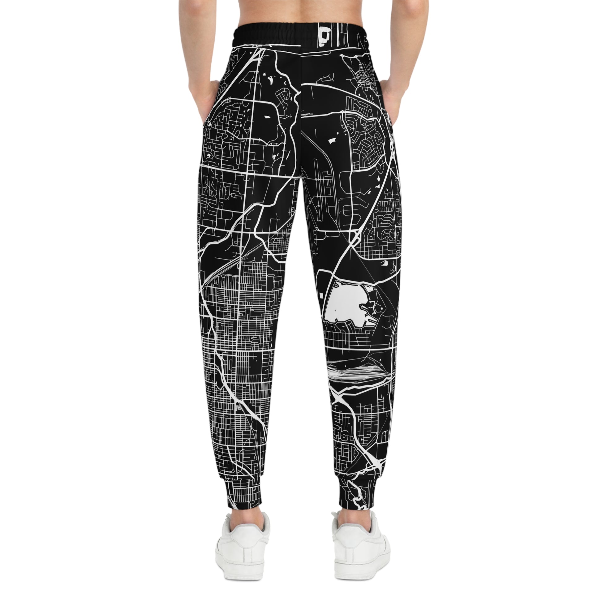 Model wearing Lincoln Nebraska map joggers featuring an all-over city map design and comfortable athletic fit.