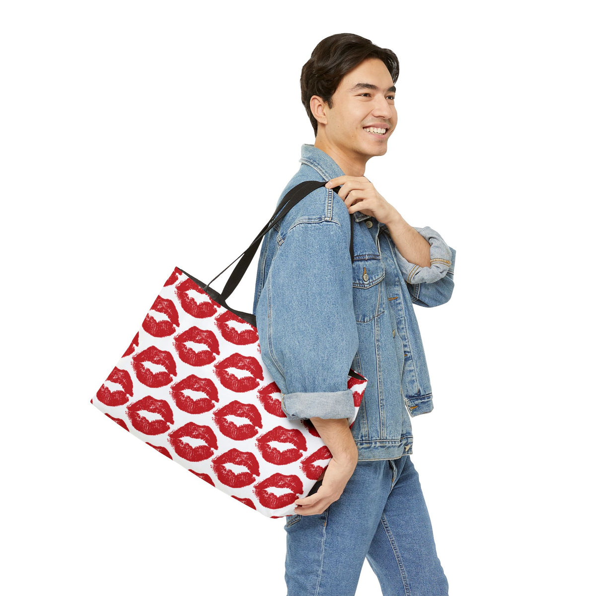 Lipstick kiss print weekender travel bag carried as an oversized tote