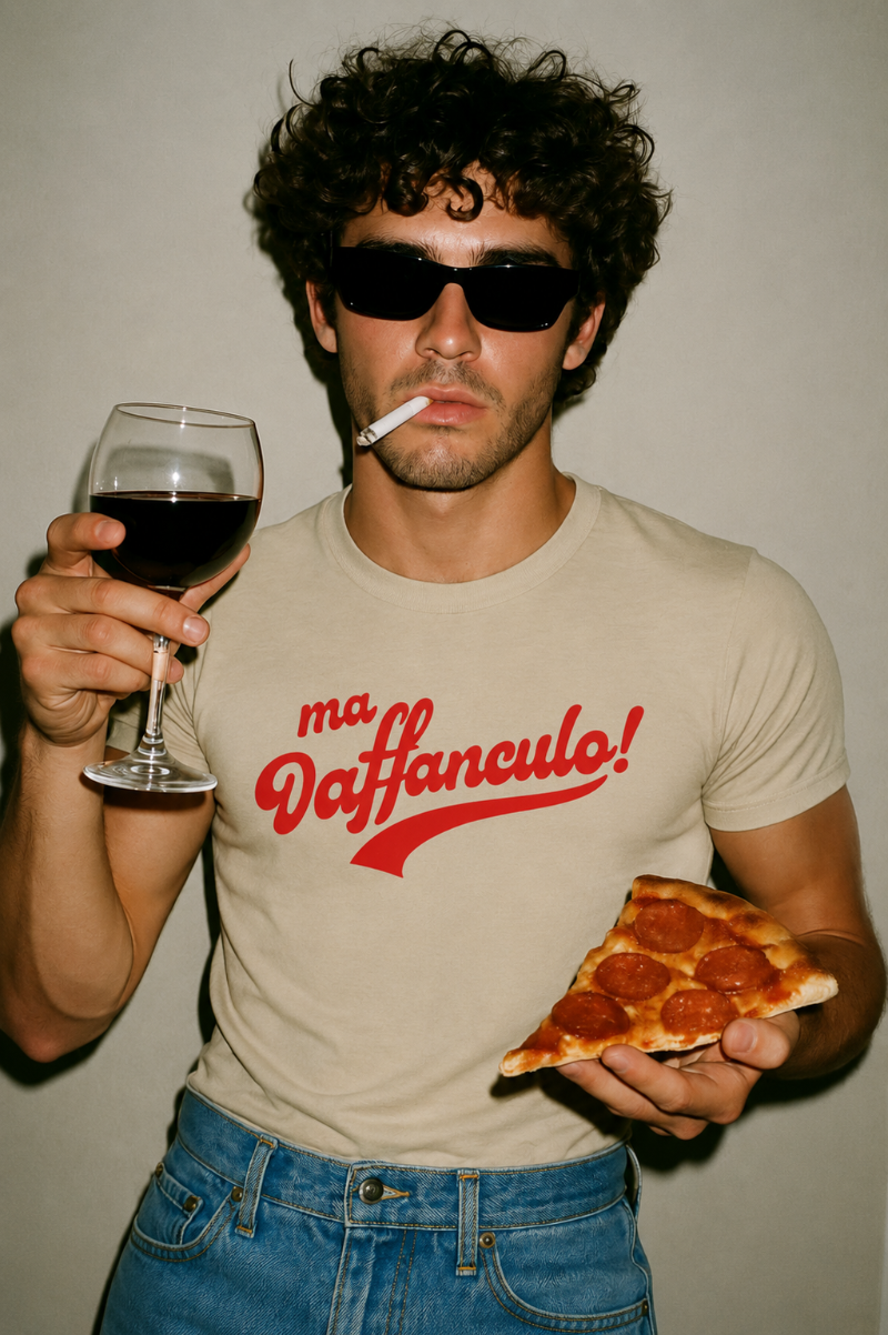 Man wearing the sand Ma Vaffanculo graphic t-shirt holding pizza and wine.