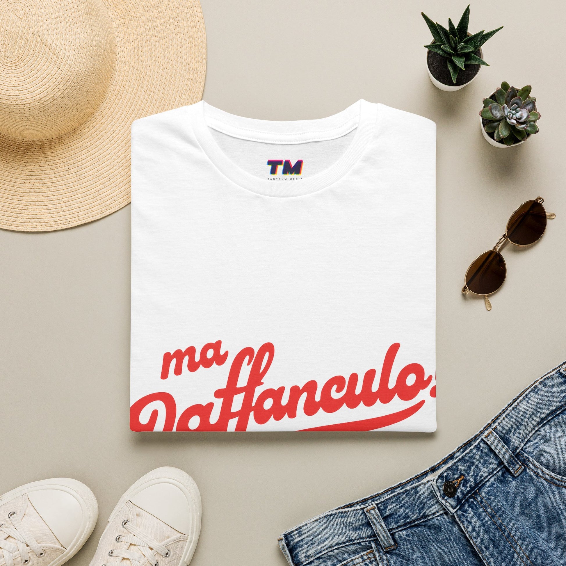 White Ma Vaffanculo graphic t-shirt flat lay with casual lifestyle accessories.