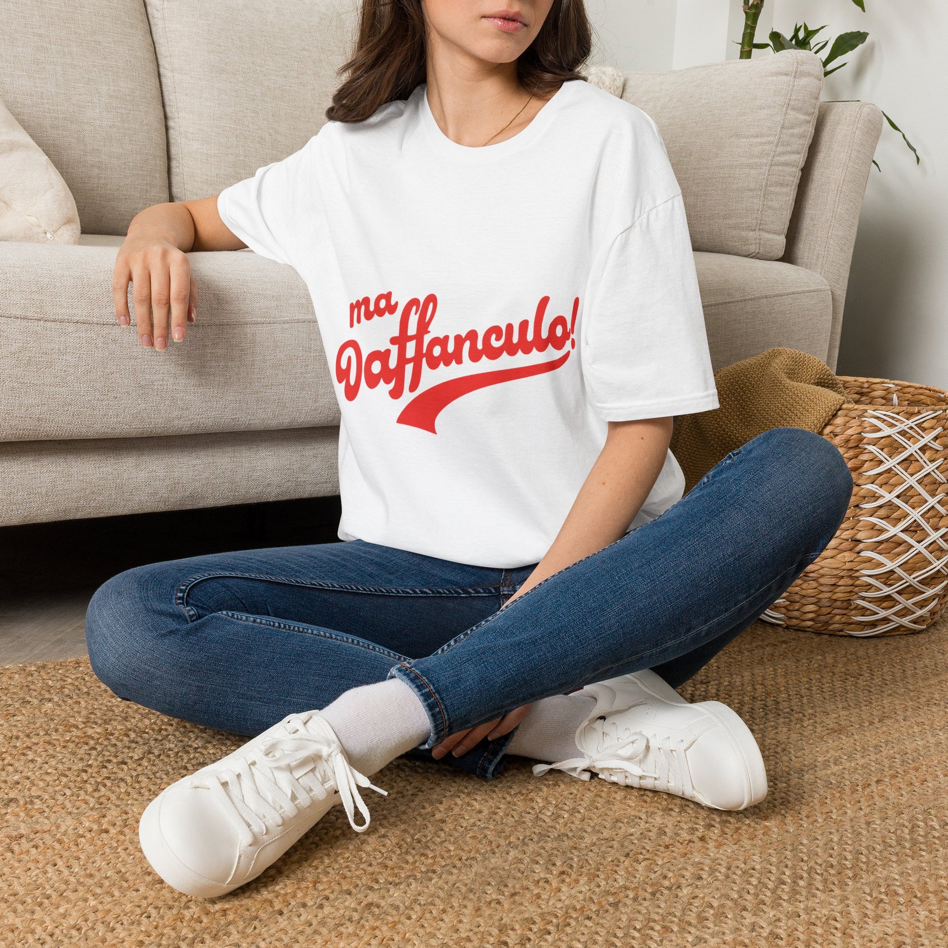Woman wearing the white Ma Vaffanculo Italian graphic t-shirt relaxing indoors.