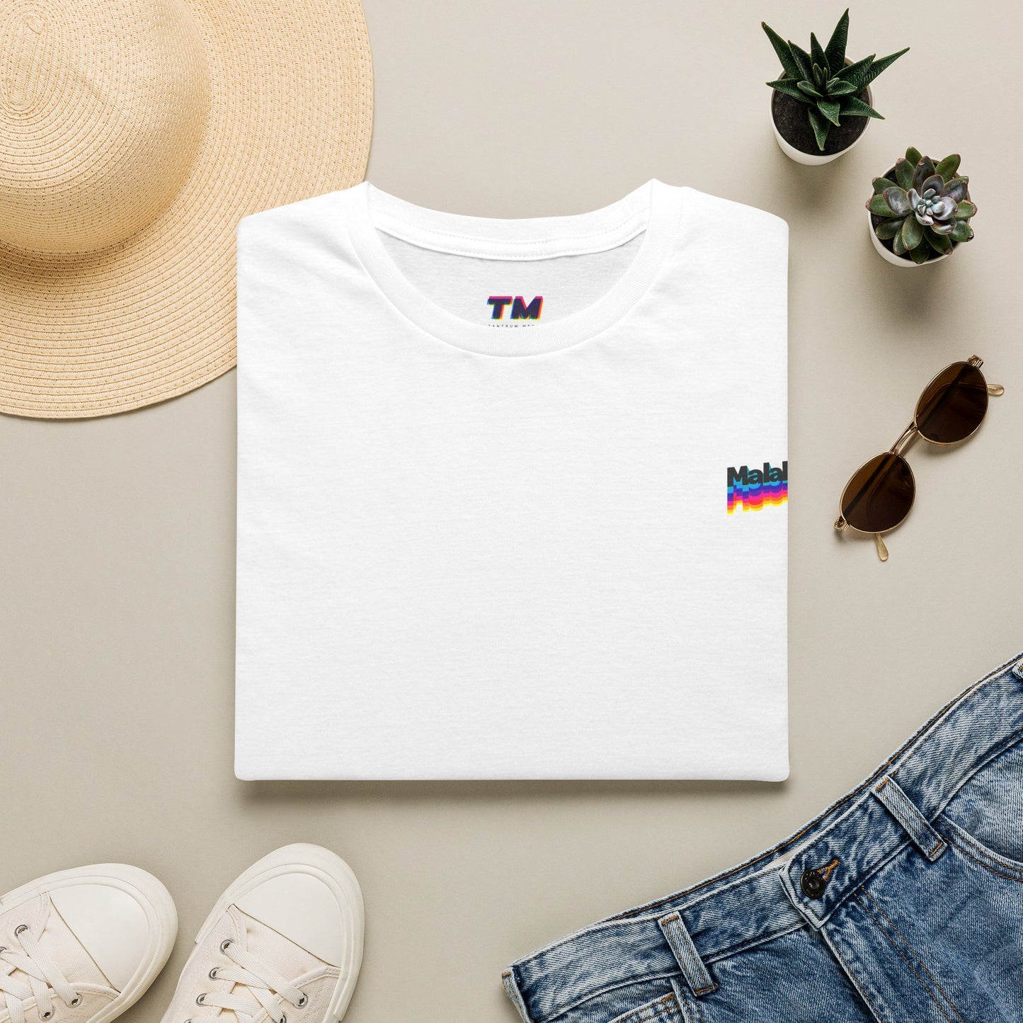 White Malaka Greek slang T-shirt with small chest graphic styled with jeans and casual accessories