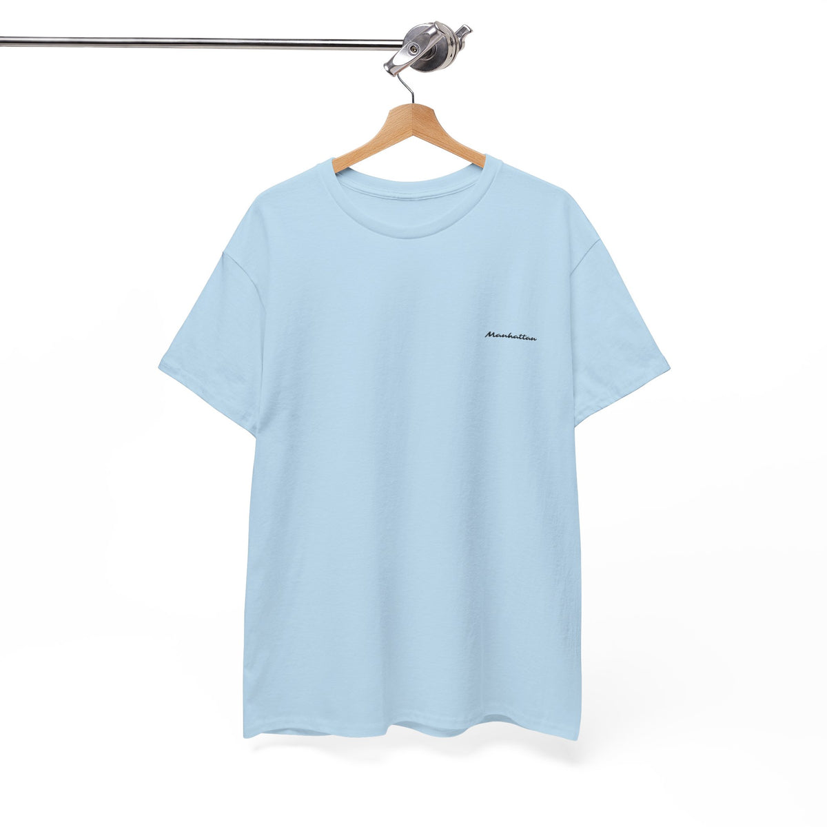 Light blue Manhattan short-sleeve T-shirt displayed on a wooden hanger.